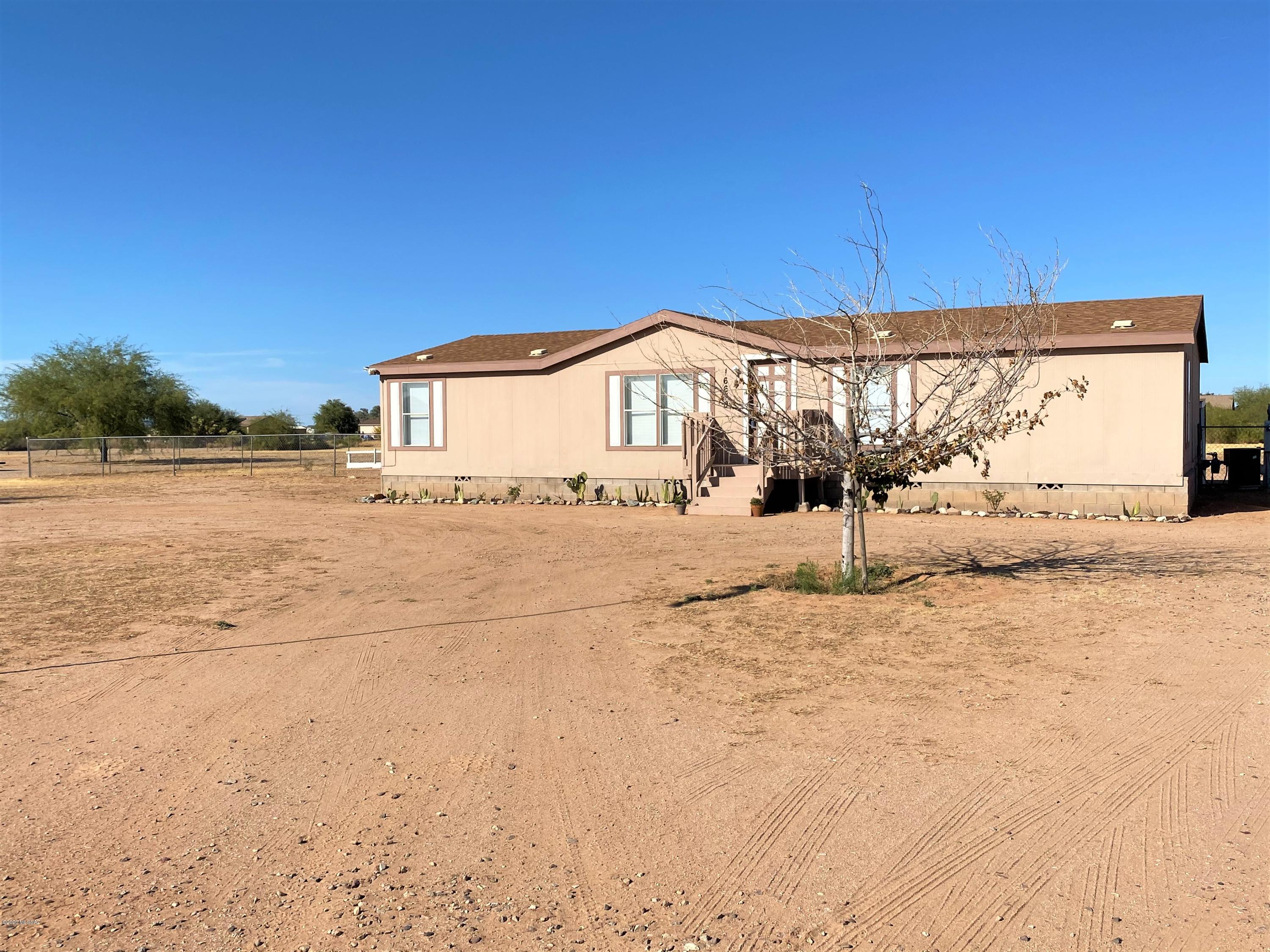 Seller will entertain/counter offers between $175k-$200K. Nestled in the quiet natural surroundings of Marana. This beautiful home features an open, inviting floor plan for family to spend quality time. All appliances will convey. There are endless possibilities for outdoor living. The backyard is entirely chain link-fenced in. There is a separate garage and shed in the backyard to use as you wish. The landscape is low maintenance with a garden and grapefruit, peach, orange & lemon trees to enjoy. Take in the breathtakingly quiet and relaxing living that Marana has to offer that is close by convenience stores and good schools.