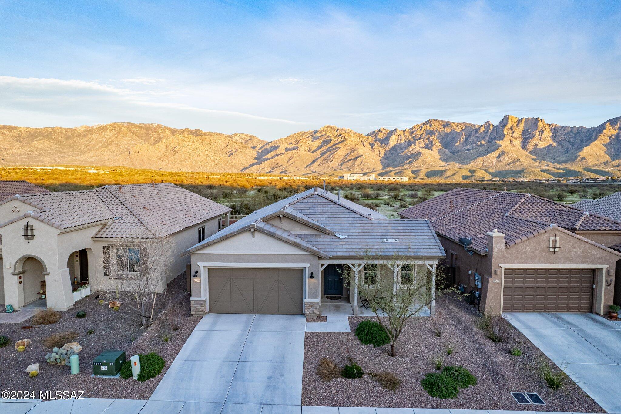 Welcome to this 2021 Pulte built home in the private community of Rancho Vistoso Valley Vista. At 2045 sq ft, this split bedroom Barletta floor plan interlaces modern convenience with elegant finishes to create bright and inviting living spaces with unobstructed views. This thoughtfully designed 3-bedroom, 2-bath, 2.5 car garage home, with large bonus flex room / study, features a traditional exterior and a welcoming walk-up front porch. The spacious chef's kitchen with gas cook top and stainless steel appliances is finished in upgraded Lillian Purestyle cabinets in Glacial Grey color and matched with Bianco Montanha granite counters and custom back splash. Center island opens to a generously sized great room that carries through to the back porch that backs up to a pedestrian path, hiking trails, and an expansive desert landscape with views to Catalina. The rear portion of this home has been extended by the builder to allow for extra living space. The primary suite is large with no lack of storage, including a separate walk-in closet and additional linen closet. Double vanity with cultured marble counters, and a beautiful upgraded walk-in tile and glass shower make this entire room an owner's retreat! You'll enjoy the back patio both morning and night, so bring your coffee and wine, and make this nearly new house, still under builder warranty, your home. Over $75, 000 in designer chosen builder upgrades. Enjoy the desirable masterplan amenities including a large community park featuring a dog park, multiple playgrounds, ramadas, grassy play areas and sport courts. 
* Owner/Agent
* Buyer to verify all facts/figures including those in the MLS.