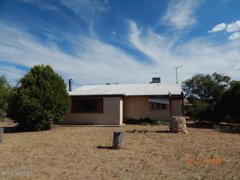 This property is in dual marketing in the MLS as well as auction status. The home is located on a quiet 1 block street that dead ends at a wash. Schools are a short distance away. Large fenced yard with a storage/workshop building in the rear yard.