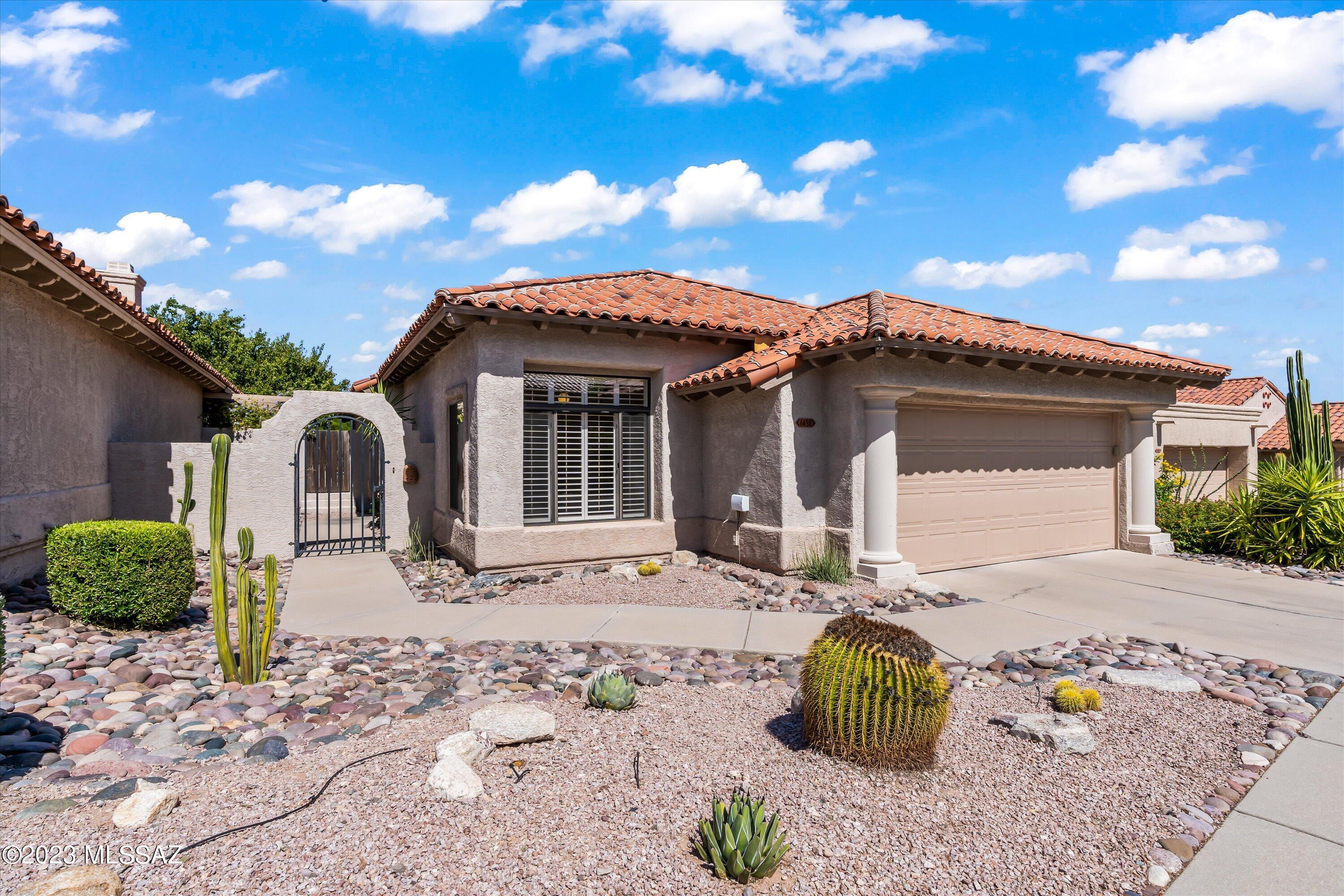Live in the Ventana Canyon corridor and in the heart of the Catalina Foothills. Homes in the popular Las Ventanas neighborhood rarely become available. The community offers a pool, spa, sidewalks & refuse collection. This low maintenance home backs to a desert common area with mountain views. Enjoy the sunrise over the Catalinas every morning from your breakfast nook & brick paver patio. The many updates include: a kitchen remodel in 2016 with all white cabinets & appliances, granite countertops, an enlarged entrance to the kitchen & an additional pass through to the dining area, HVAC units installed in 2010, new tile flooring in the kitchen, dining room, hallway & laundry room.  Interior laundry area with upper cabinets. The newer washer & dryer are included with this move-in ready home.