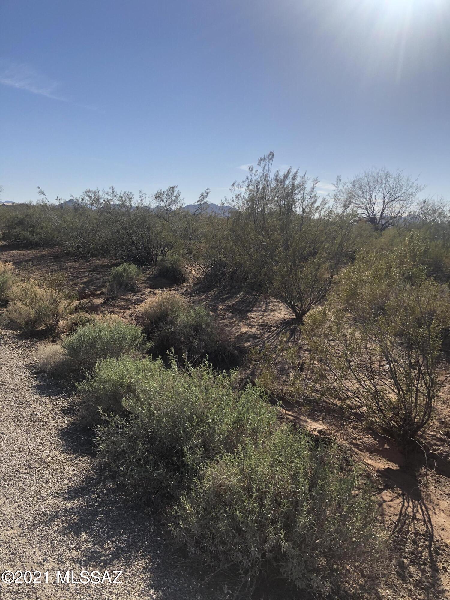 The rural life is wonderful! This beautiful 4.13 acre lot is flat and easy to build on or put a manufactured home on. The lot south (parcel 208-25-094F) is also available and can be sold together for a large 8.26 acre lot. The escrow will be at Title Security, Marcia Cormack, 520-219-6451, as title work has been completed.