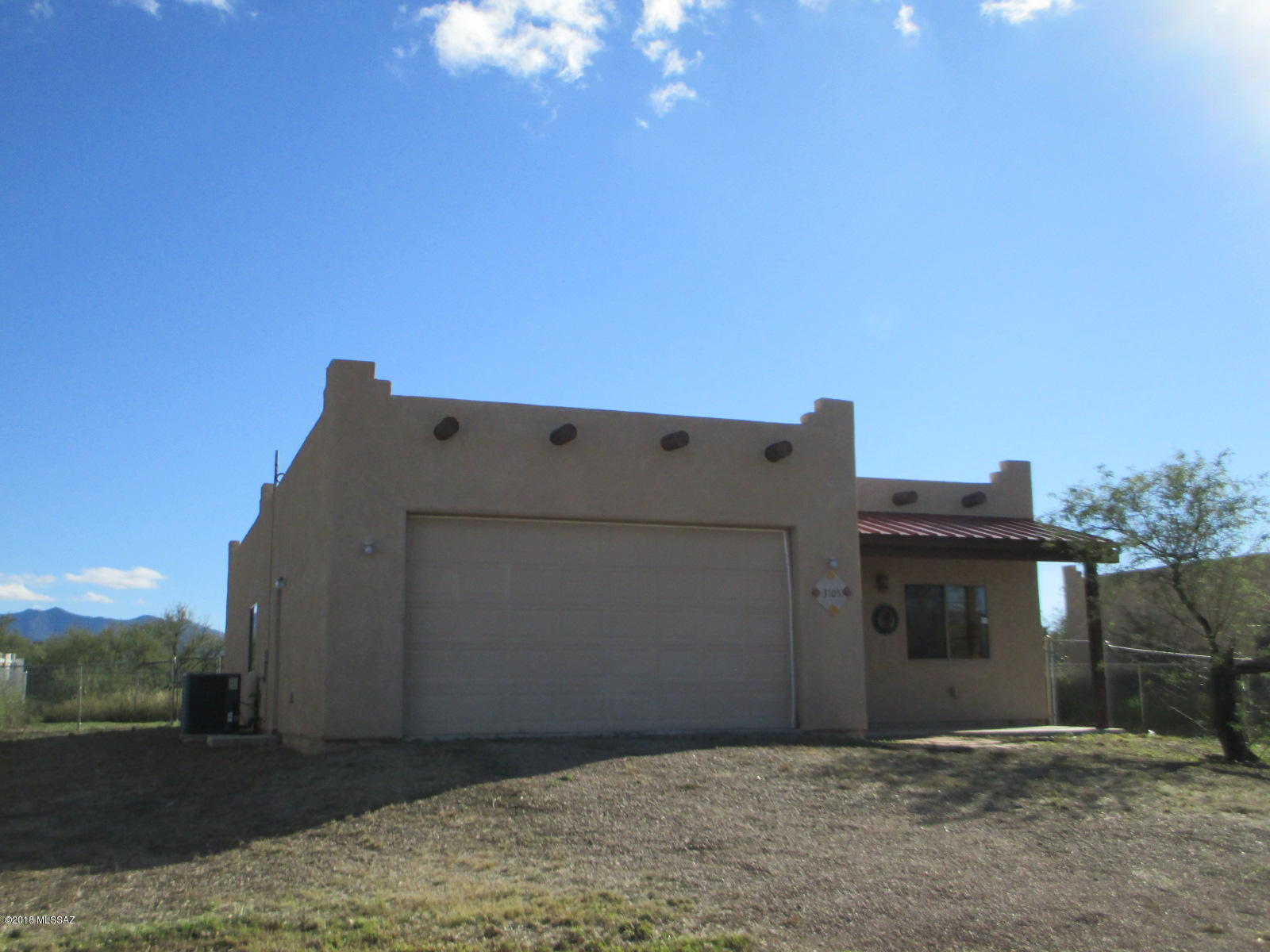 Get away from it all in quiet Mescal. 3 bedroom, 2 bath home with 2 car garage. Easy commute to Tucson, Sierra Vista or Benson. Constructed in 2007 this Santa Fe style home has many upgrades - featuring granite countertops, stainless steel appliances, easy care diagonal tile & tile baseboard throughout the entire home. Relax in the master bath while soaking in your jetted tub, then retire to the spacious master bedroom. One bedroom has french doors that lead to the covered rear patio. Low care landscape and fenced back yard with mesquite trees. Water supplied by Mescal Water Co.
