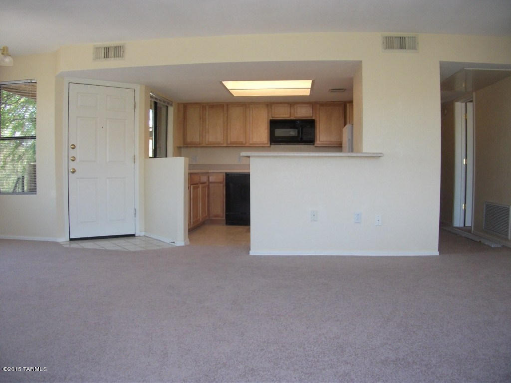 2 Bedroom 2 Bath Top Floor-End Unit condo in desirable and Gated Villas at Sabino Canyon. Open kitchen with small dining nook. Living room has fireplace and big windows that provide lots of natural light and gorgeous views of the Catalinas to the North and Sabino Mountain to the South. Primary suite has a private bathroom and patio, built in storage as well as walk in closet. Indoor full size washer/dryer, assigned covered parking. Community comes with pool, spa, exercise facilities and is located in the District 16 School System. Pets are subject to owner approval. This unit is offered as NON-SMOKING.