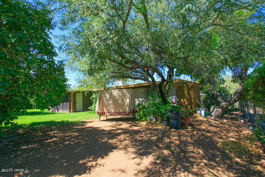 Beautifully updated 4 bed/2 bath two owner home available now! This nicely upgraded home has been in the same family since it was built. Come relax in this beautiful, lush backyard landscaping which includes a mature citrus tree and enclosed Arizona room. Both bathrooms and kitchen are completely upgraded and ready for you to enjoy. The master includes a large walk-in closet and all bedrooms are great spaces for a variety of uses. The kitchen boasts a large open arrangement, perfect for entertaining. This home has a new air conditioner (2016) and water heater (2016), ready for you to move in and enjoy!