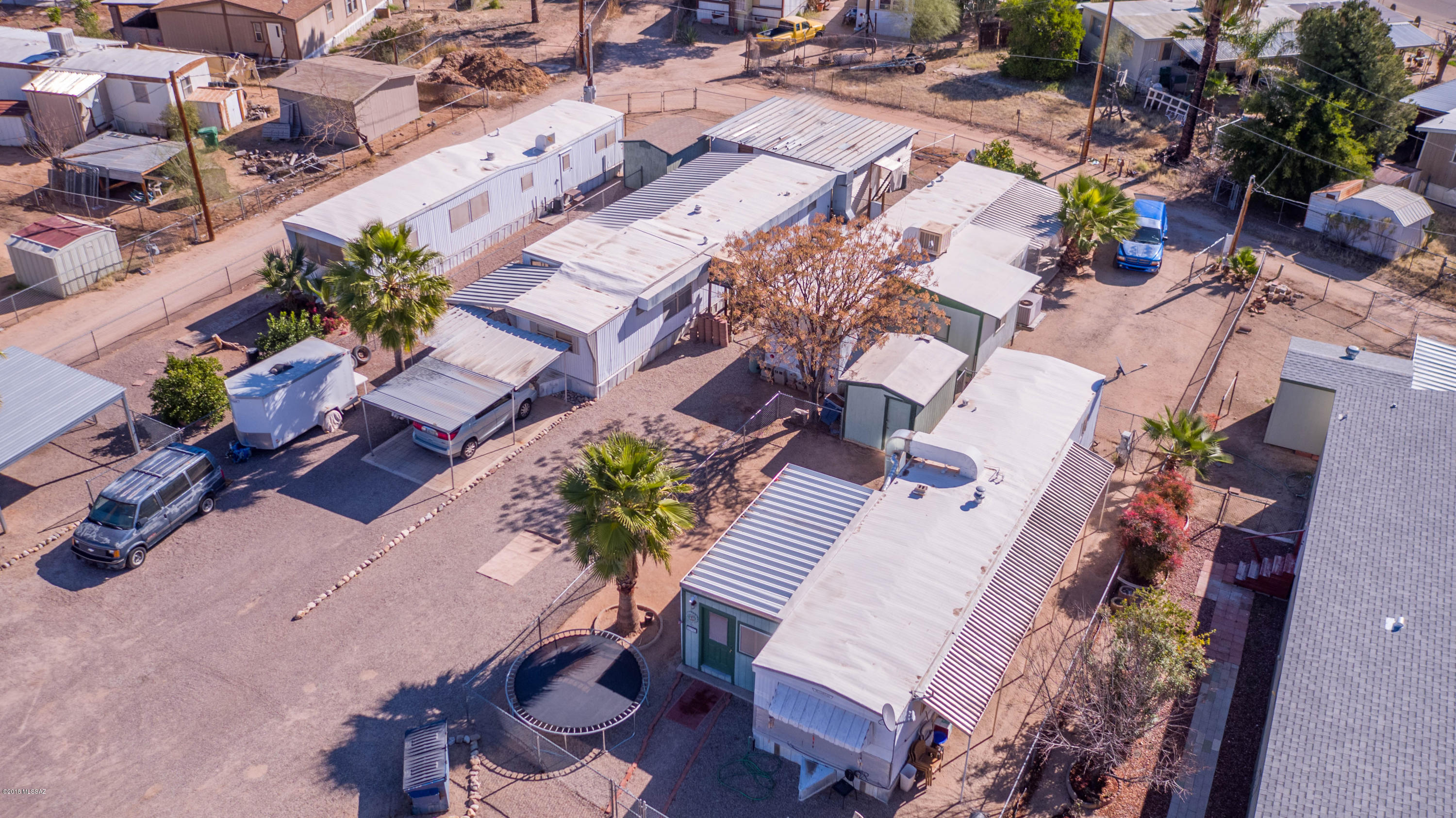 11.5% Cap Rate! Reliable Income Producer, 4 Mobile Homes On 2 Lots, Sold As A Package, Total Acreage Of .41 Acres; 1 Unit Is Affixed, All Are Completely Remodeled Inside, Very Clean & Very Well Maintained By The Long Term Owner With A Total Of 3184 SqFt; 3 Units Are 2 Beds/1 Bath & 1 Unit Having An Extra 1/2 Bath, Another Has 3 Bedrooms; Separately Metered Gas & Electric, Landlord Pays Taxes, Sewer, Water & Trash; 2 Shared Storage Sheds, Separate Garage/Storage Unit; All Units Feature Central Air, 2 Have Evap Cooling As Well, New Roof Coatings, Updated Electric Panels, All Appliances Included, Lots Of Off-Street Parking, 2 Units Have Carports & 3 Are Fenced;  Live In 1 Unit & Rent The Others, A Very Clean Property That's Close To All Major Roads, Public Transport, Shopping & Everything!