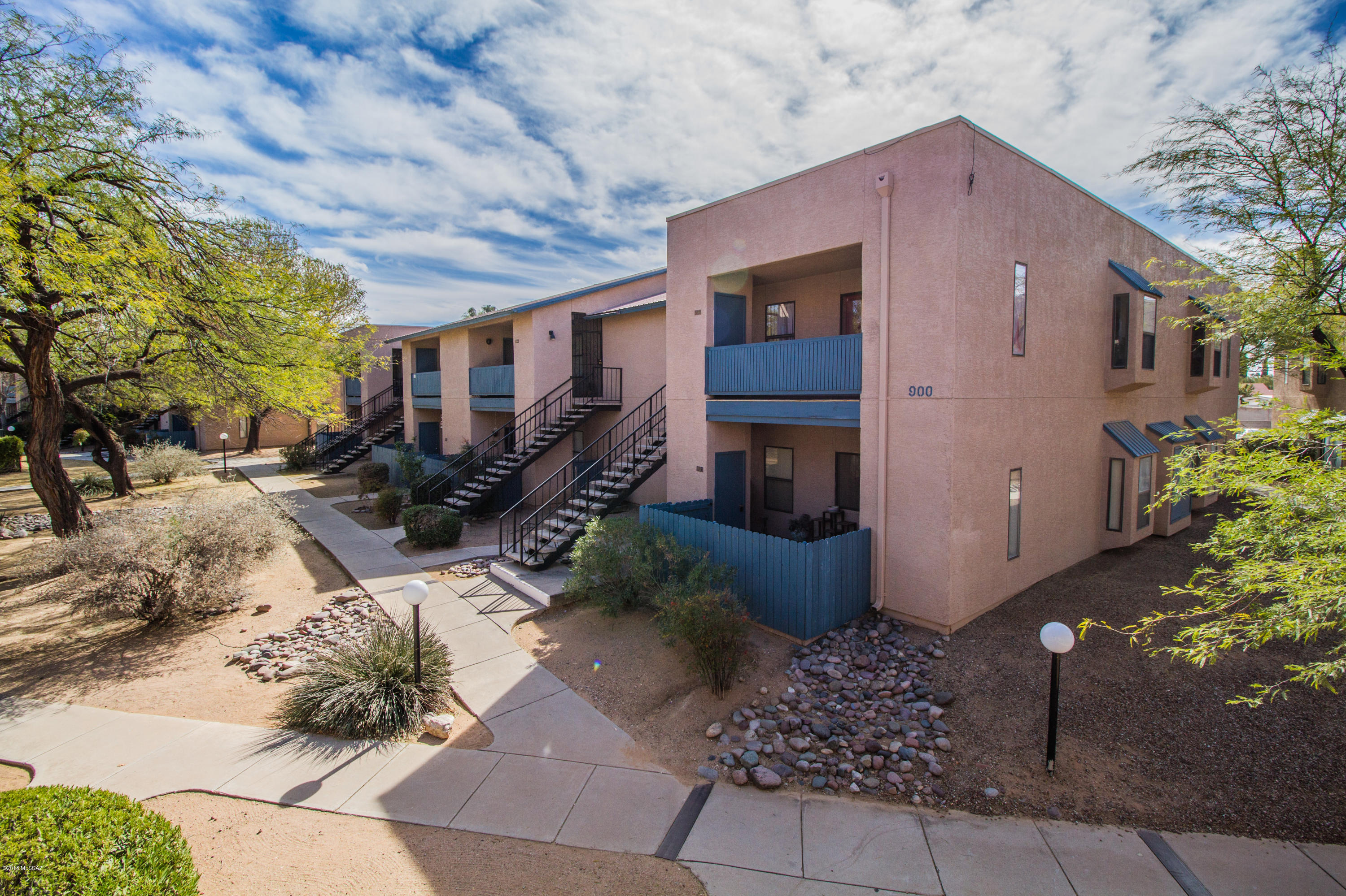 Beautiful top floor condo located close to bus lines, shopping and restaurants. Spacious open floor plan with great room, large bedrooms and generous walk-in closet in mater bedroom! Neutral plush carpet, built-in breakfast bar and built-in cabinets in great room. Great location in complex near the pool, sports court and the beautifully landscaped grass area with trees and shade surrounding. Fenced in front patio with storage area to sit and enjoy the views! Covered parking spot close to front door. HOA fees include water, trash, exterior bldg. maintenance and common areas. Don't miss out on this great spot!!