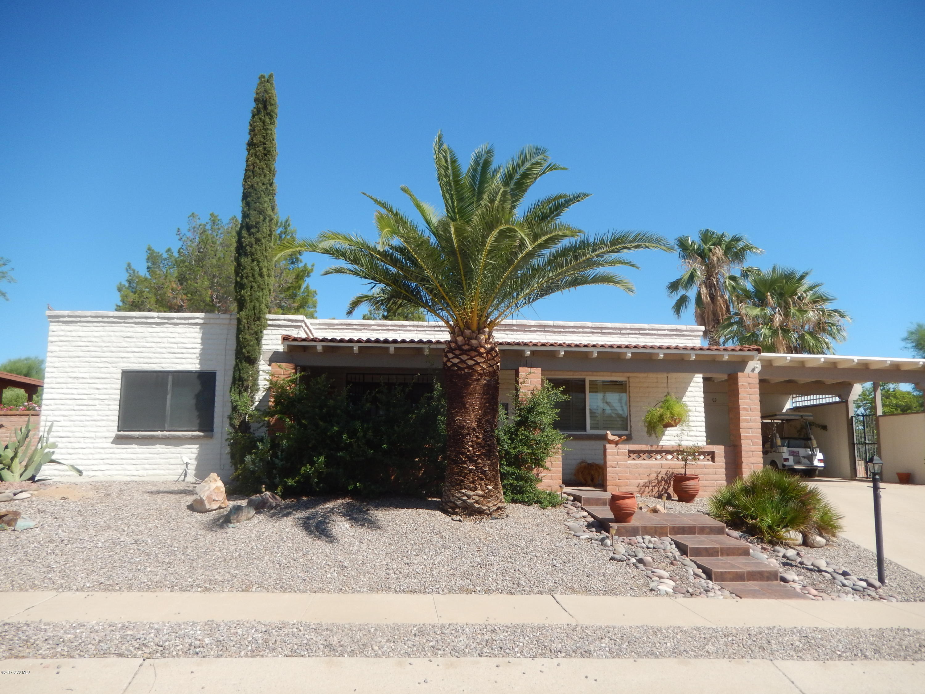 Just the right size with a bright and beautiful open kitchen and stainless appliances. Lovely AZ room with electric fireplace. Large backyard with many trees including orange and lemon. 2 Large bedrooms and updated baths. Laundry room with extra storage. Located in desired Country Club Vistas offering convenience, wide streets, variety of homes, and low HOA dues. Most furnishing available.
