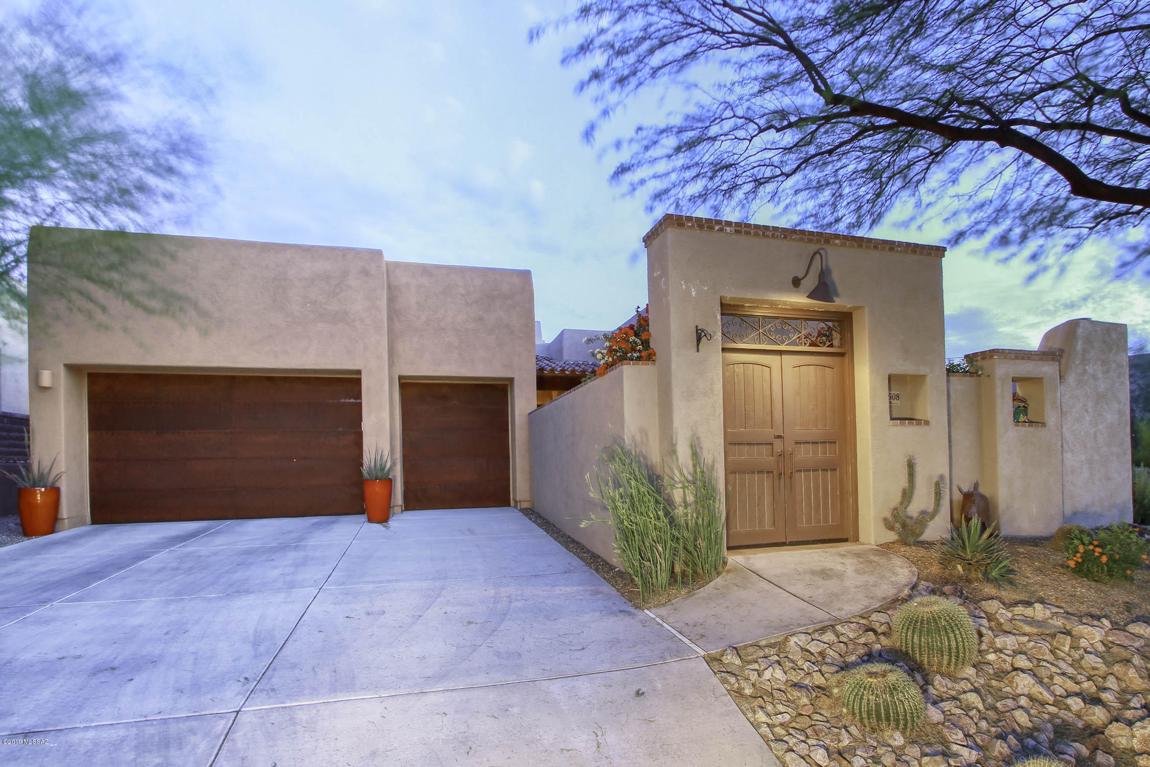 Gorgeous 4BD/3BA (2,604sqft) upgraded home with pool, built by Insight Homes in the gated community of The Preserve at Dove Mountain. Backs to a natural preserve for privacy and views. No neighbors behind. Enter through a gated front courtyard, with fireplace, to find a private Casita with full bath, perfect for guests. Open concept chef's kitchen with granite countertops, SS appliances and adjacent great room with fireplace. Spacious master suite hosts a luxury bath. Other features include 3 car garage, recent paint inside/out, concrete floors (no carpet), 15' wood beam ceiling & more. Resort style backyard with newer pebble-tec saltwater pool with waterfall & spa, professional landscaping and views! A must see.