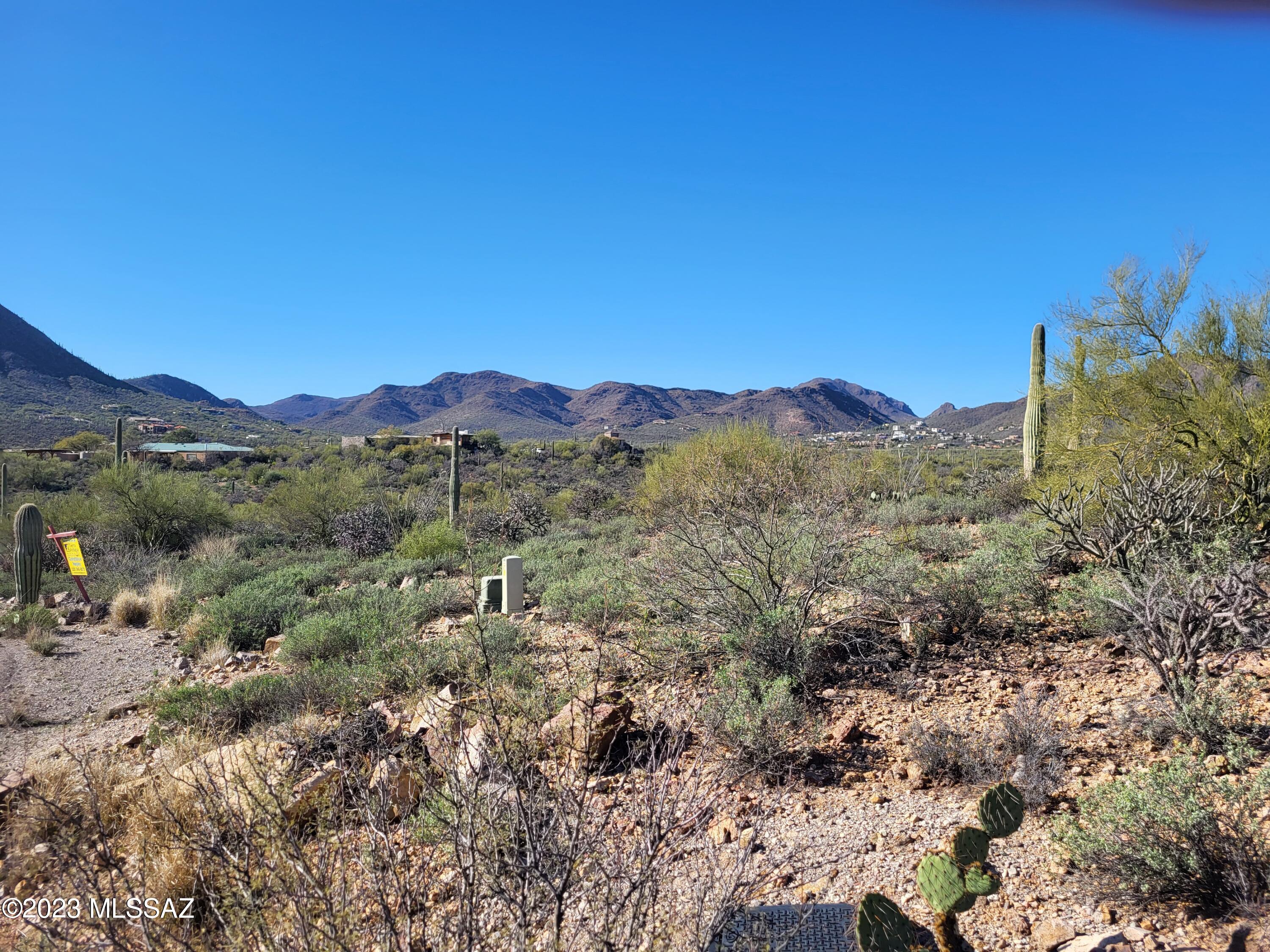 Seller will consider all offers! 1.6 acre lot located in the Enclave at Gates Pass. Gated and private subdivision of custom homes sites. Panoramic City and mountain views surrounded by Saguaros, Palo Verde trees and rock outcroppings. Water and electric at the lot. Septic system will be needed.  Seller owns a total of three lots in this subdivision. Can be purchased separately or all three as a wholesale package deal.