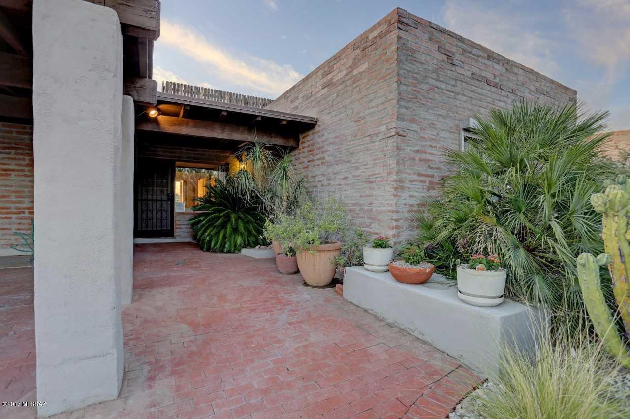 Charming 3 bedroom, 2 bath 1862 square foot,burnt adobe home is located in the unique community of Serenidad with only 55 homes on two streets.  Saltillo tile throughout. Living Room features beamed ceilings, charming fireplace, Mexican tiled window seat(banco). Formal Dining Room. Sunset and mountain views. Community Pool.  HOA includes maintenance of the common areas, trash collection, road maintenance.