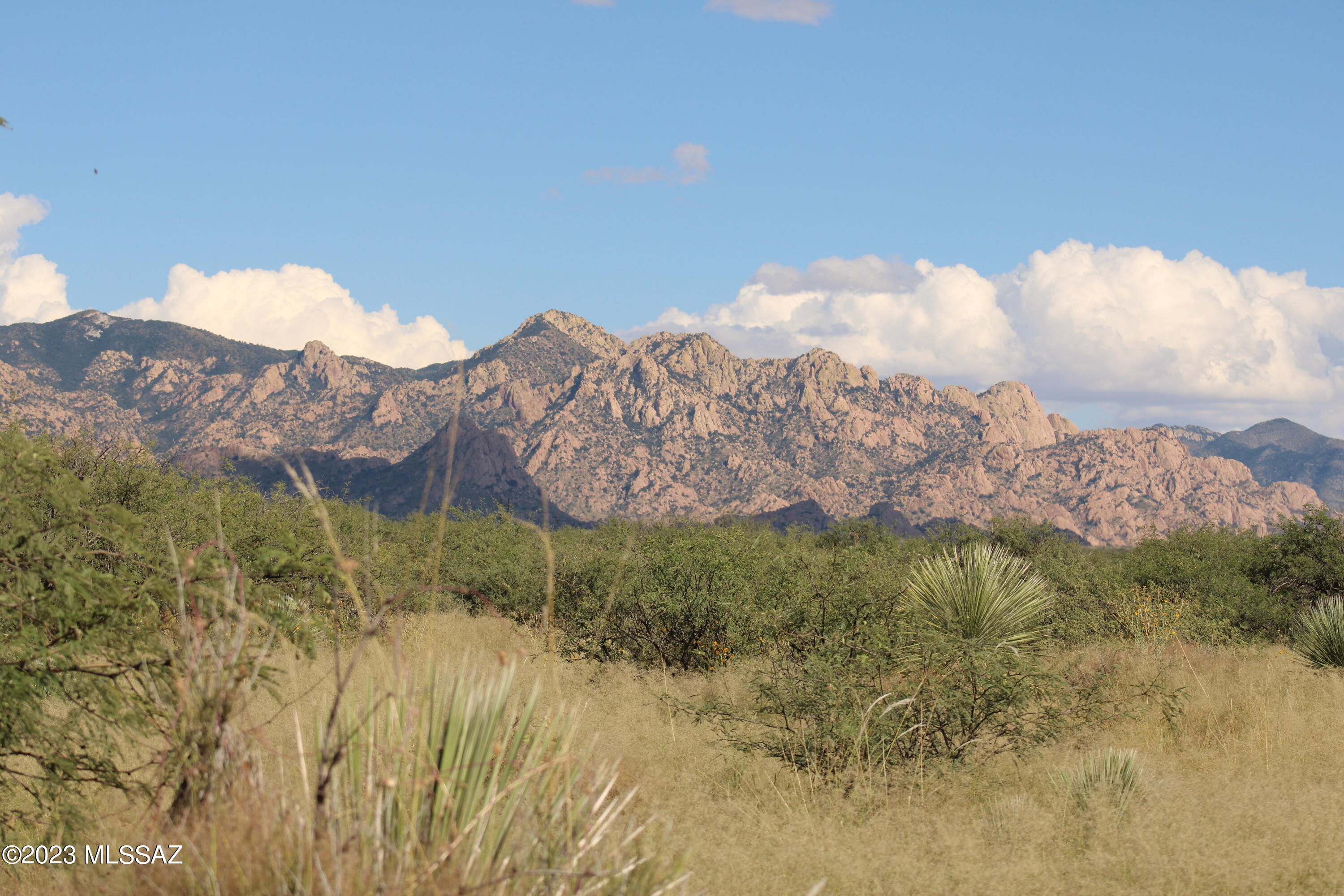 Beautiful 360 panoramic view of the Dragoon Mtns and Whetstone Mtns. Dragoon Mountain Ranch subdivision is located in St David AZ. This gated community has a common area with a Community well and a heliport for emergency use. Lot M44 is located within the Meadows Subdvision in the northern section of Dragoon Mountain Ranch, consisting of 131 properties with a minimum of 36.0 acres each. This lot comes with power on the property. The ranch consists of apprx 14,000 acres and adjoins 52,000 acres of the Coronado National Forest wilderness area. The ranch is also adjacent to thousands of acres of State Trust lands. Both the National Forest and State Trust lands provide a wildlife sanctuary. The elevation of the lots in the ranch average 4700 ft.The adjacent Dragoons as well as the Rincons range to an elevation of over 7000 feet. Originally the Horse Ranch was established in the 1800's. Nearby towns and cities are Benson, Bisbee, Tombstone, Willcox and Sierra Vista all in Cochise County.Tucson is about 1 hr drive from the ranch.