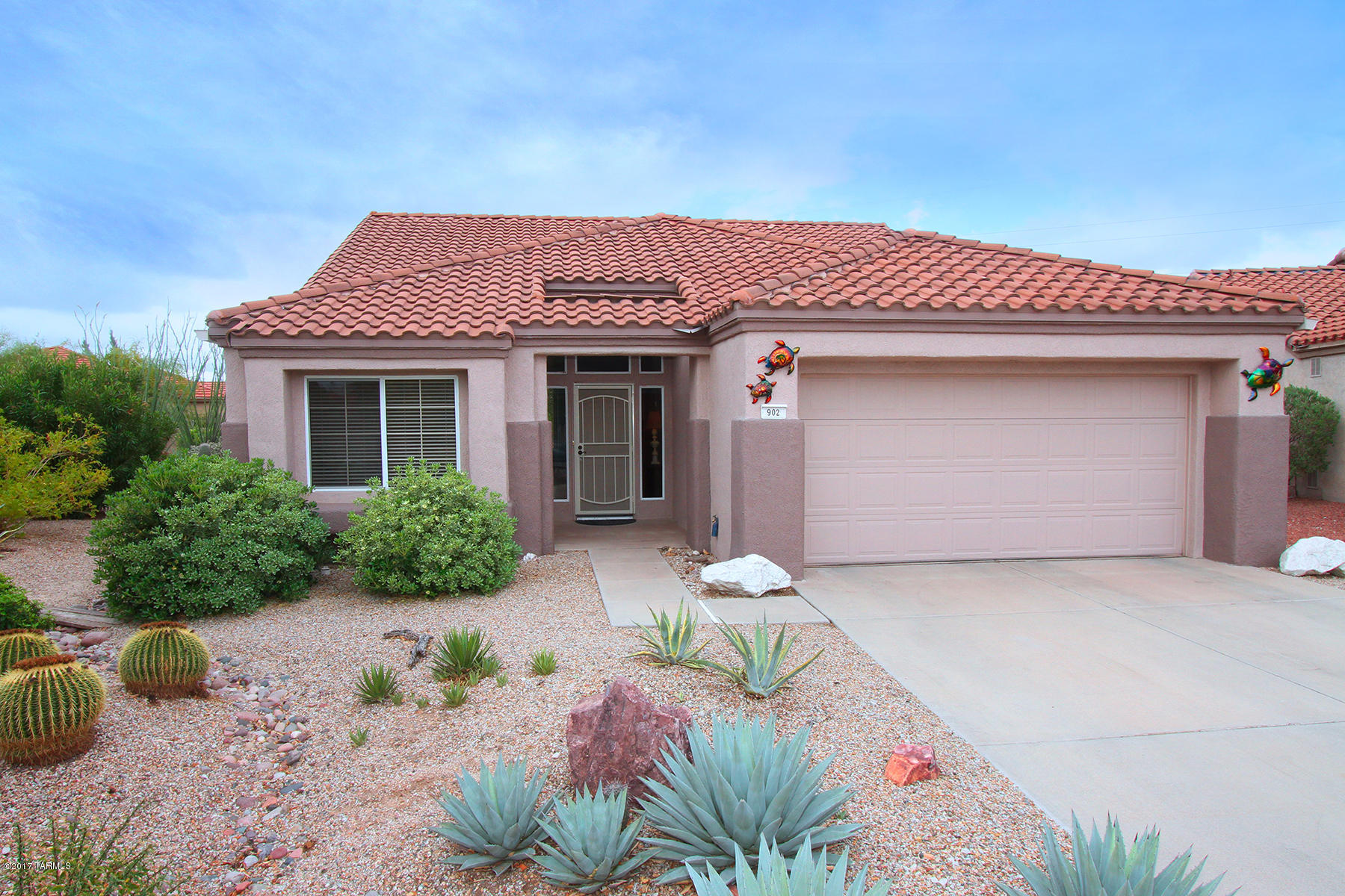 Enjoy Sun City Vistoso's active adult community in a beautifully updated 2bd/2ba (1,592sqft) Barclay Model home located on a cul de sac with and oversized back yard and mountain views.  This split bedroom open floor plan is very desirable and functional. New tile floors throughout home (no carpet). Open concept chef's kitchen with SS appliances, plenty of storage and nook with bay window. The spacious master suite features a walk-in closet & luxurious bath with garden tub & oversized shower. Exceptional sizable backyard with outdoor fireplace, covered/uncovered patios and views! Age-restricted Sun City offers fitness center, weights, racquetball court, pool, tennis, pickle ball, library w/computer center. Nearby top-ranked hospital, urgent-care, medical services & Oro Valley Marketplace.