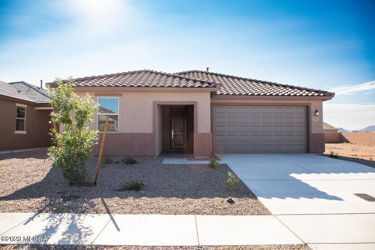 This beautiful, single-story home features an open floor plan with 9-ft. ceilings and a spacious great room that leads to a covered back patio ideal for entertaining. Whip up culinary delights in the modern kitchen, which boasts granite countertops, white cabinets, an island, breakfast bar, pantry and Whirlpool® stainless steel appliances, including a gas range, side-by-side refrigerator and dishwasher. The primary suite showcases a walk-in closet and connecting bath that offers a dual-sink vanity and shower with marble surround. Seller will accept or counter offers between $341,990 and $354,929. Lowest price relies on incentive of $12,939 provided by seller and predicated on using seller's preferred lender KBHS.