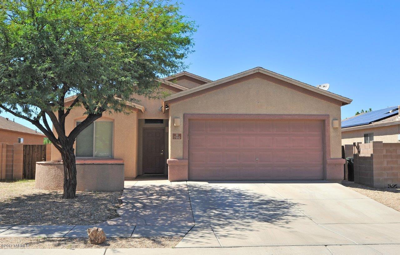 Roomy one level home with 3 bedrooms and 2 baths. Open Great room concept with a large living area.  No choppy floor plan here!  The kitchen has plenty of cabinet space and there is a generous  pantry  for food and your kitchen gadgets.  Ample counter space to prep for a big family meal.  The breakfast bar will seat at least 6 people and is a great spot for guests to gather  or for kids to have their lunch. The dining area is quite large and will easily accommodate your dining room furniture. Split bedroom plan. Master  has a walk-in closet. Phone and cable jacks in every room and alarm installed. Extended garage  has a finished floor, copious storage cabinets, and a work bench. Easy access to DMAFB, minutes from Downtown, and nearby neighborhood parks.