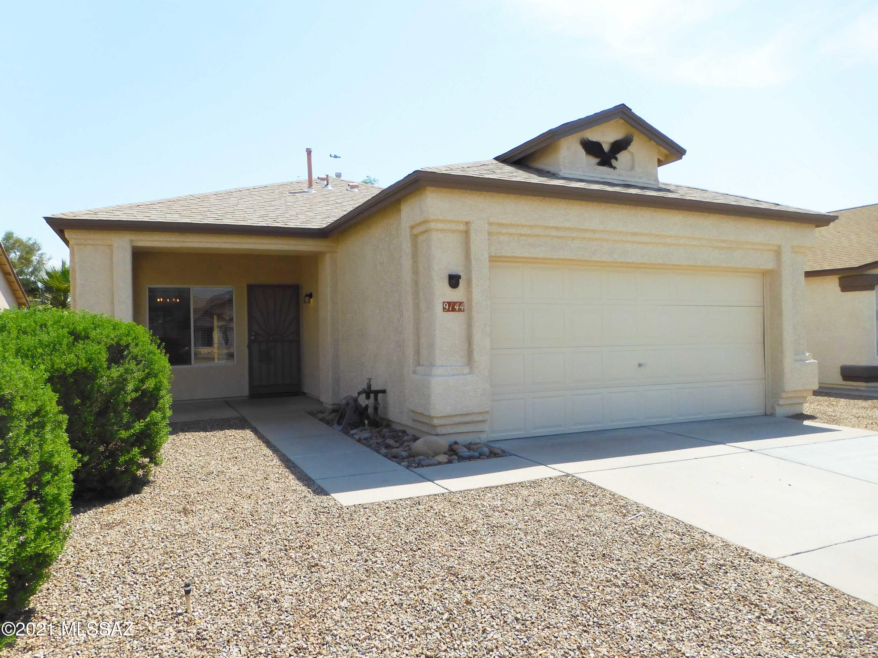 Vail School District. No Carpet! This Charming home features 3br/2ba, vaulted ceilings, fresh paint, laundry room and a 2-car garage in desirable Rita Ranch. Tiled living room & formal dining area. Kitchen with SS Dishwasher, SS Electric Oven/Stove, SS fridge & separate pantry. Spacious Master Bedroom with Walk-in Closet, double vanity, tub/shower combo. Covered patio & expanded paver area in block fenced backyard. LED Lighting. Ceiling Fans. Close to Super Walmart, Fry's supermarket, quick access to freeway & close to major employers. Popular Purple Heart Park (dog parks, skating park, public swimming pool, etc) not too far away. 2 small pets Ok. This is a must see home for rent! Non Smoking Home. Renter's Insurance required.