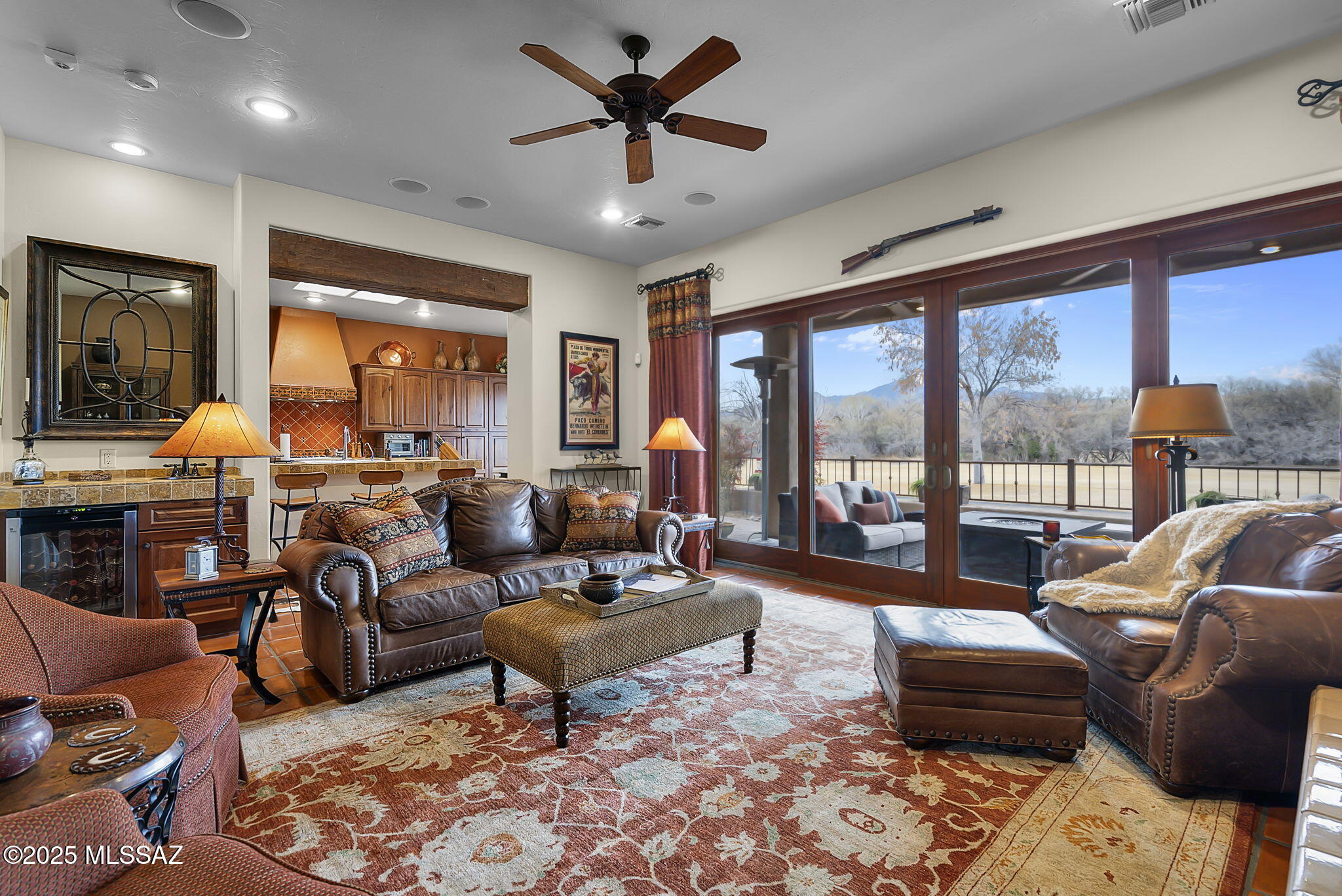 Golf Course Elegance! Tubac Golf Resort Home! This perfectly maintained home is an upgraded Maderno Grande model built by Dorn Homes in 2008 on the #1 Anza fairway. 3 BR, 3.5 BA home. Large private front courtyard with fire pit, fountain, and Cantera stone upgrades for added elegance. The great room, with tall ceilings, wood beams, wet bar, and fireplace opens to the back patio with golf course and mountain views. The gourmet kitchen has SS appliances, granite counter tops, large pantry cabinets and dining area. Office/media room, spacious laundry room off the large 2-car garage entry. Large primary bedroom and bath with tub and walk-in shower. Generous closet spaces throughout. The attached guest quarters feature a gas fireplace and exterior entry. Fireplace on rear patio plus sky deck.