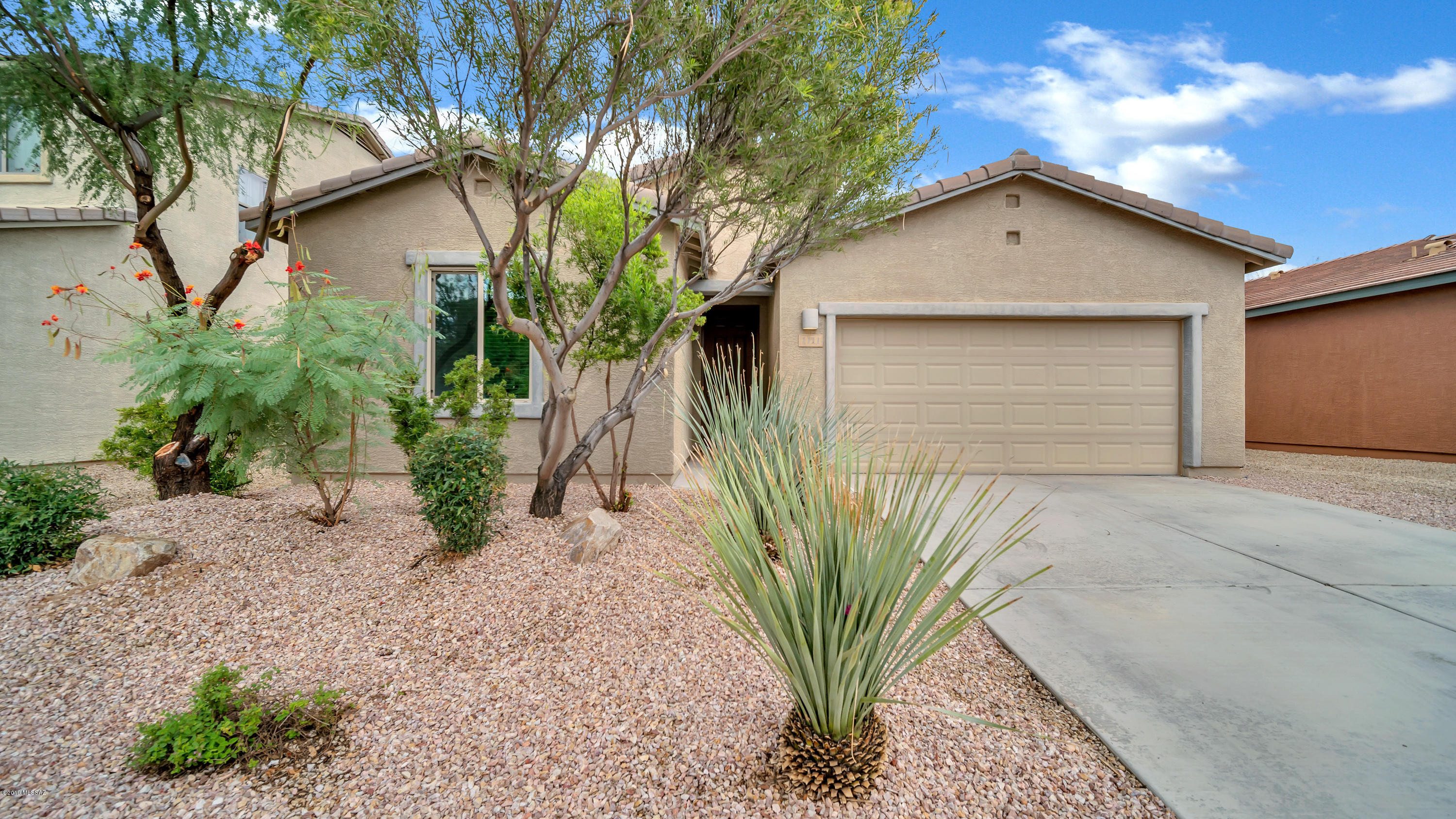 Enjoy the picturesque view of your backyard from the comfort of your kitchen in this peaceful Madera Highlands home. The kitchen is delightful and bright with beautiful granite counter tops, lots of storage and 36in cabinets!
 The outdoor space is perfect for entertaining with an extended, covered patio and firepit. This serene atmosphere surrounds a home built for family time and togetherness. The private master bedroom offers dual sinks with executive height marble counters and a walk in closet.
This home is complete with a water softener and reverse osmosis system.