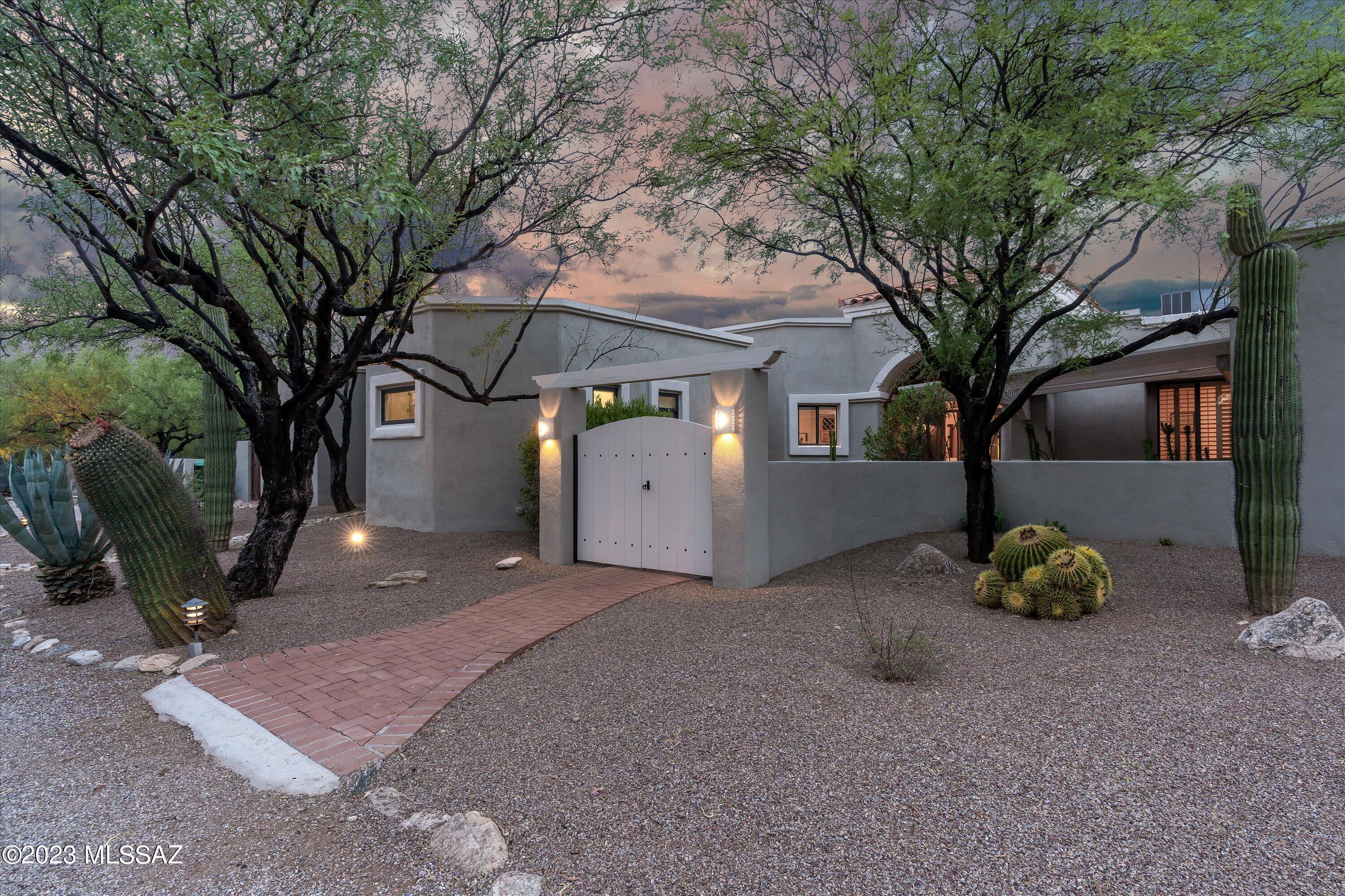 Enjoy stunning mountain views from all windows on this private-gated-horse property in the NE of Tucson. This custom 3 bedroom/split plan (with bonus rooms!) offers a spacious 3 car garage w/workshop area, beautiful horse facilities as well as chicken coops-chickens can convey. Bright and open with views from all windows. Backyard faces the Catalina Mountains and has a wonderful shaded entertaining space. Ride horses from the house to trails close by! Close to Agua Caliente Park and easy access to Mt Lemmon Hwy for fun day trips! This one is a gem, turn key ready - don't miss out!