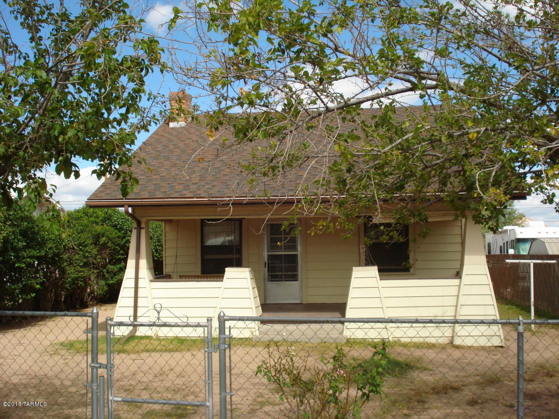 Cute updated home with lots of charm in the heart of town. One block from the school. Walking distance to shopping, businesses & downtown. Great covered front porch. Nice fenced yard with a huge detached garage/storage. Ready to move in.