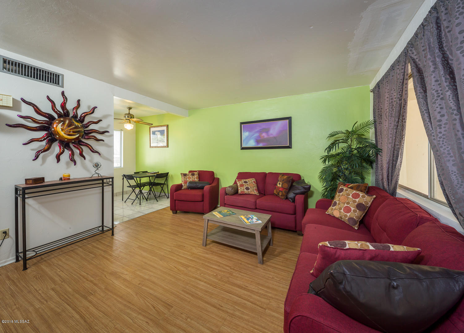 Highly desirable East Side location in Ciudad Natal Townhomes. Beautifully appointed 1 bedroom, 1 bath with soothing and tranquil paint colors throughout. New laminate floors and updated flooring in the master bath make this unit move in ready. Community pool, on site laundry facilities, close to shopping and entertainment as well. No popcorn ceilings here...HOA covers pool, laundry facilities, common areas, water, trash, sewer, and exterior painting.  Hurry, opportunity is knocking!