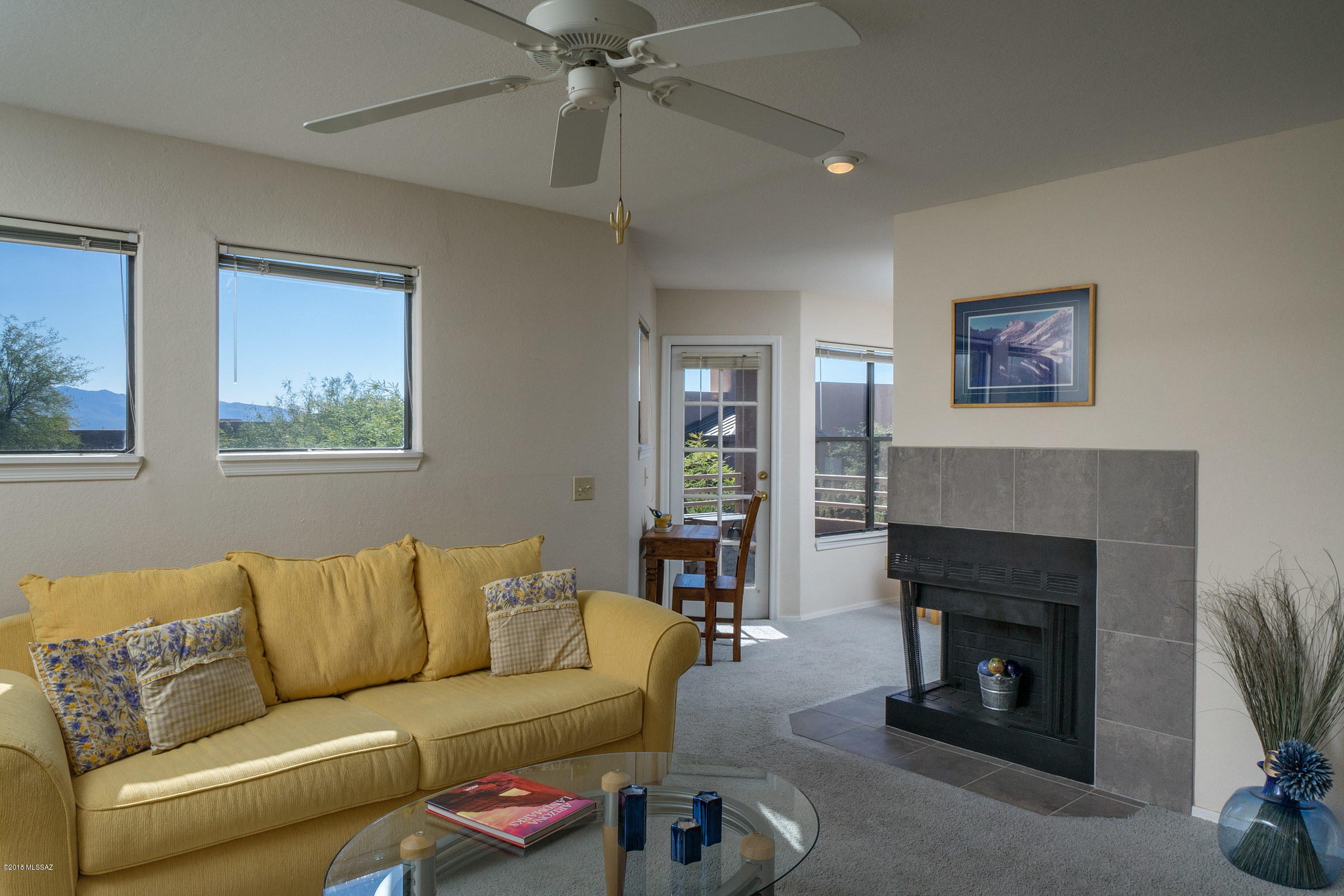Private 2nd floor corner unit condo being sold fully furnished in the popular resort style community of Canyon View At Ventana Canyon.  This secluded Northern Tucson property has breathtaking Catalina Mountain views and features a romantic wood burning fireplace, covered patio, open floor plan, chef's kitchen with stainless steel appliances & pantry, dual sinks in bathroom, covered entryway, washer/dryer included, spacious walk-in closet in bedroom and a popular location near shopping, restaurants, world-class golf & tennis and hiking.  The Canyon View Condos include two heated pools & spas, two enormous clubhouses, exercise facility, bbq areas tennis court, business center, on site HOA manager, direct access to the Ventana Canyon Trail and charming lush desert vegetation throughout.