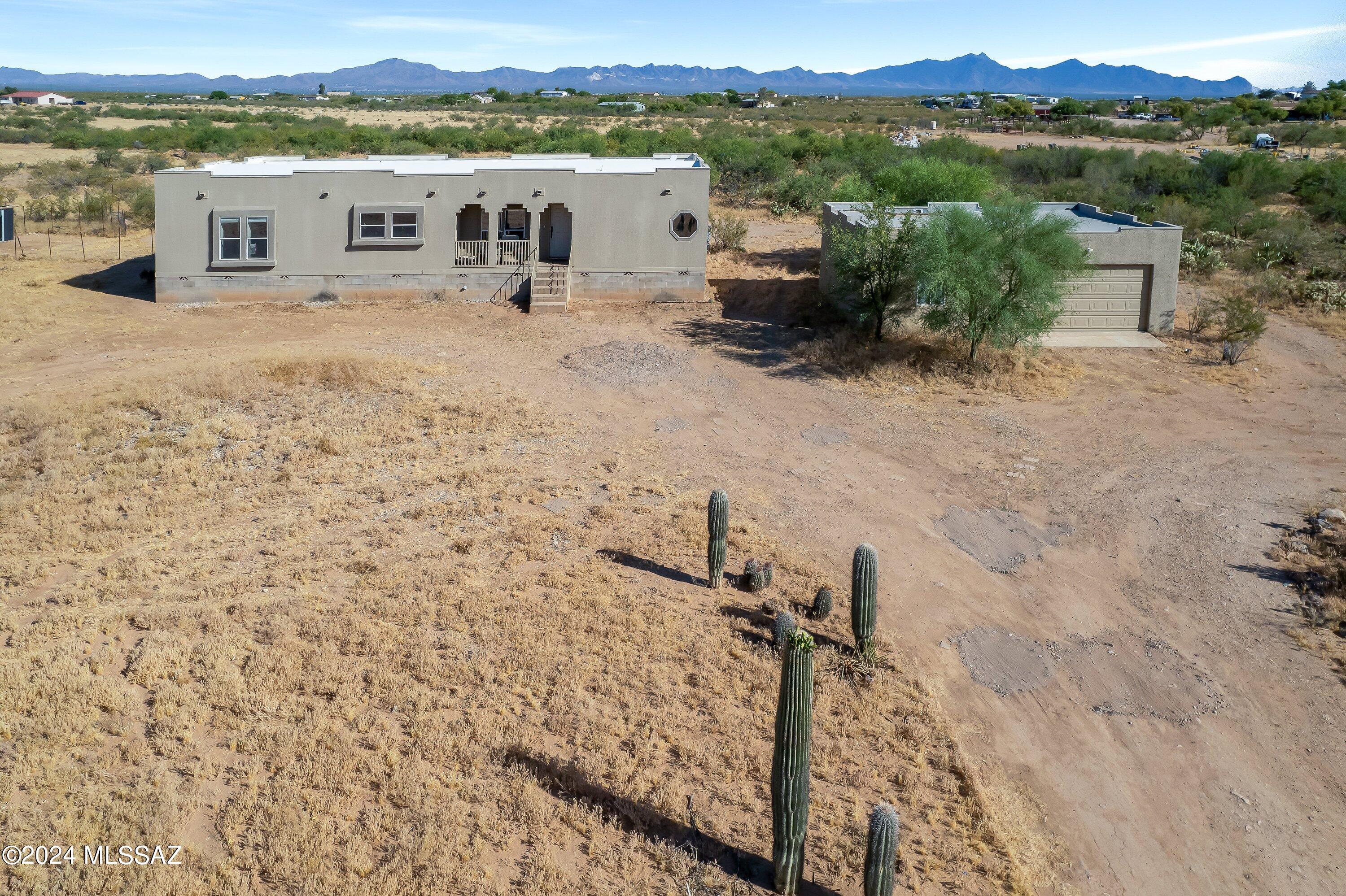 This 3 bedroom, 2 bathroom manufactured home has been beautifully updated and is situated on a sprawling 4.13 acre lot with breathtaking desert views.

Step inside to find a spacious living area perfect for entertaining guests or unwinding after a long day. The kitchen boasts modern appliances, ample storage space, and a convenient breakfast bar.
The master suite offers a peaceful retreat with its own private bathroom. 2 additional bedrooms provide plenty of space for family or guests.

Outside, the large detached two car garage provides room for vehicles and extra storage. Imagine enjoying the stunning Arizona sunsets from your expansive backyard!

Seller offering $8,000 towards closing costs.