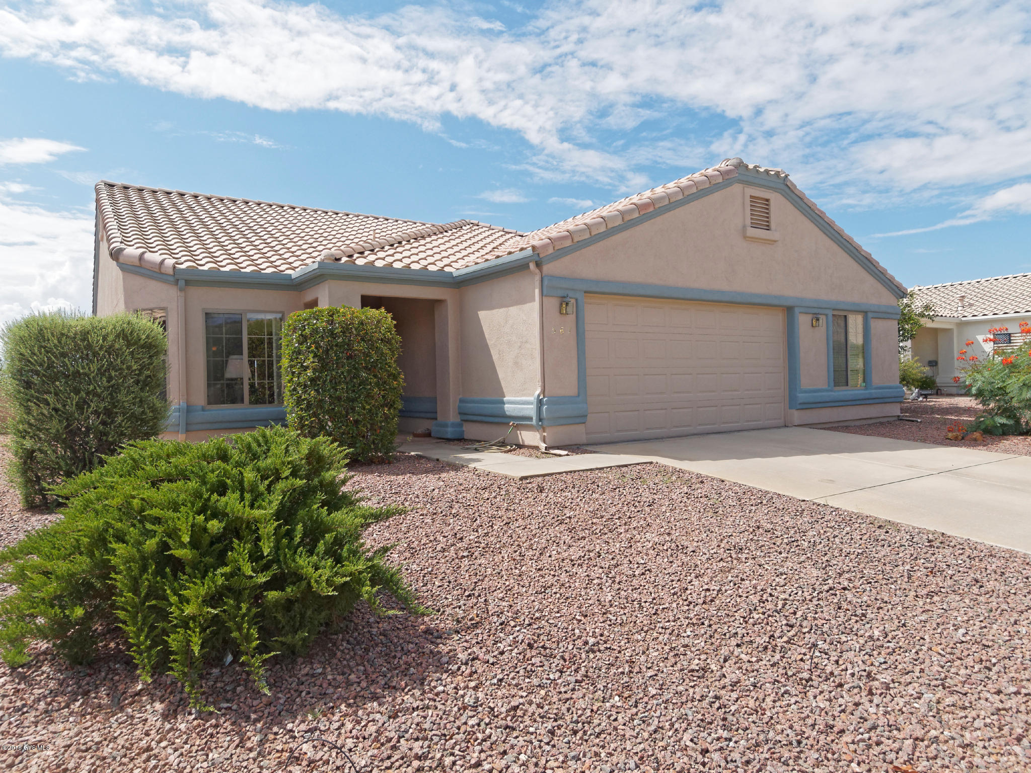 A delightful home in Desert Creek with 3 bedrooms and a Den with cathedral height ceilings, numerous art and pottery niches and desert tone ceramic tile. You'll enter into an elegant living room fashioned for special occasions with open formal dining area. Pass through the archway into a family room and kitchen where your guests will warm themselves by the gas log fireplace or enjoy a snack at the kitchen serving island. The kitchen has stainless steel appliances, bountiful counter space and cabinetry plus, a cozy breakfast nook with bay window. Double doors lead into an large master bedroom with its walk-in closet, double sink vanity and separate tub and shower. Two additional bedrooms give your guests comfort while the large den allows ample room for creativity and workspace.  After Afternoons are cool on the covered back patio with its extended brick pavers flowing out to decorative river rock and cactus islands.