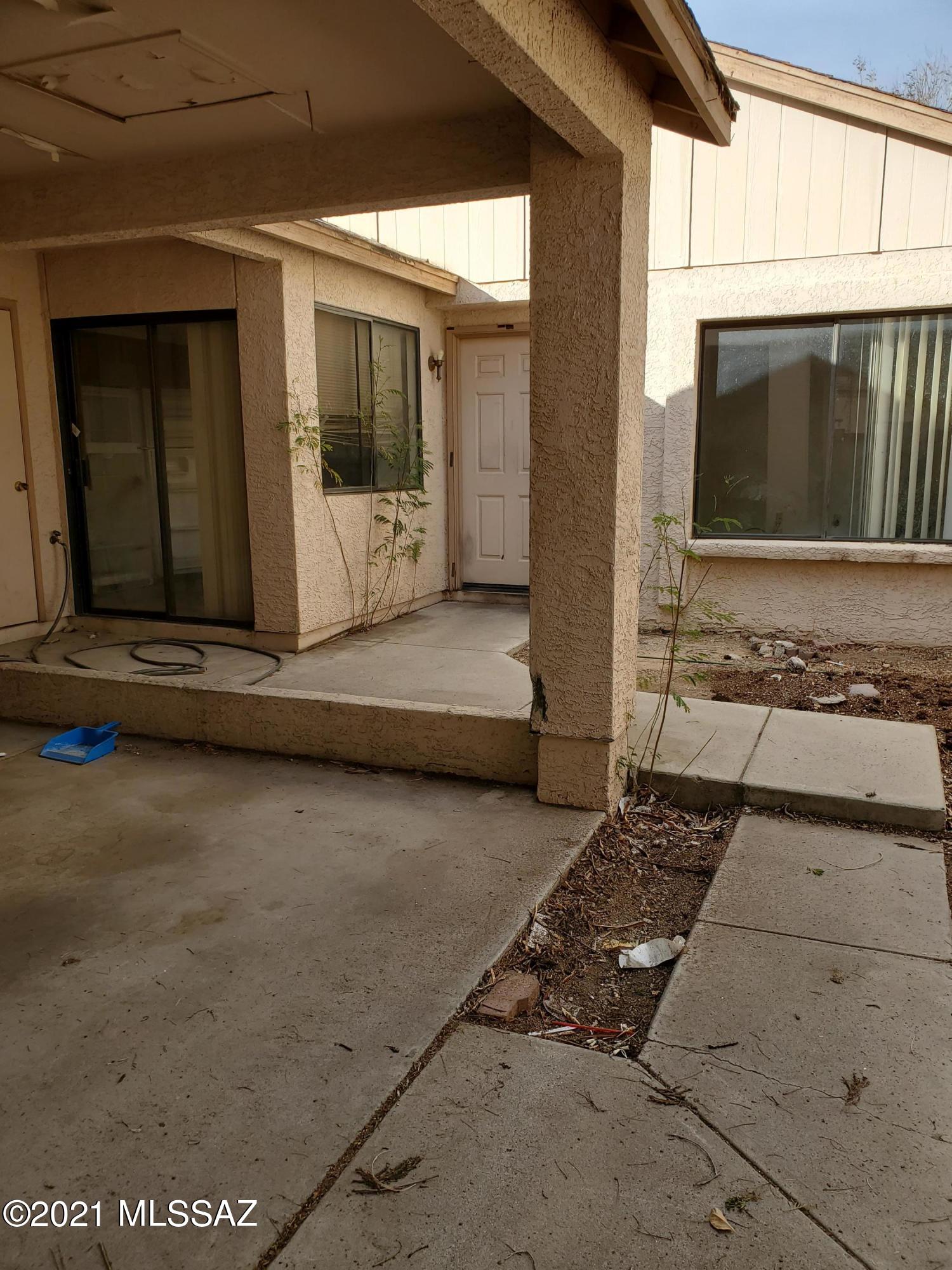 INVESTMENT PROPERTY OPPORTUNITY! Saved thousands! Townhouse, needing TLC, is located in a Gated Community with clubhouse and pool facilities. Just 5 mins from freeway, Pima College West Campus, and the UA. Great rental opportunity for students. Home is being sold ''As-is''.