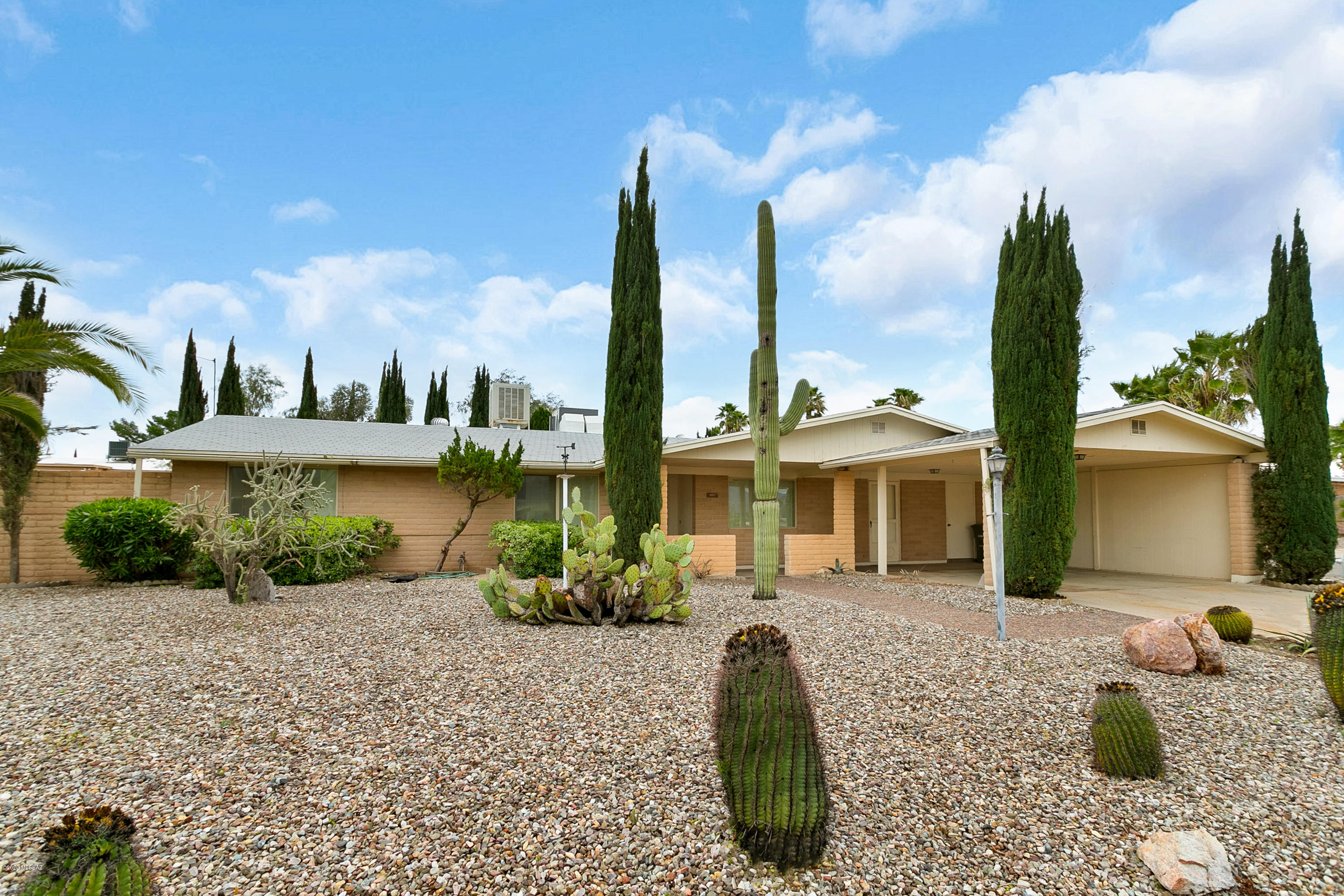 Lovely 3 bed, 2 bath ranch home on a quiet street on Tucson's east side! Huge great room with fireplace. Updated galley style kitchen with dining area and great room. Spacious enclosed block wall backyard with covered patio, mature fruit trees, and a private lap pool! Great location, convenient to schools, shopping & transportation. Don't miss out, this one will go fast!