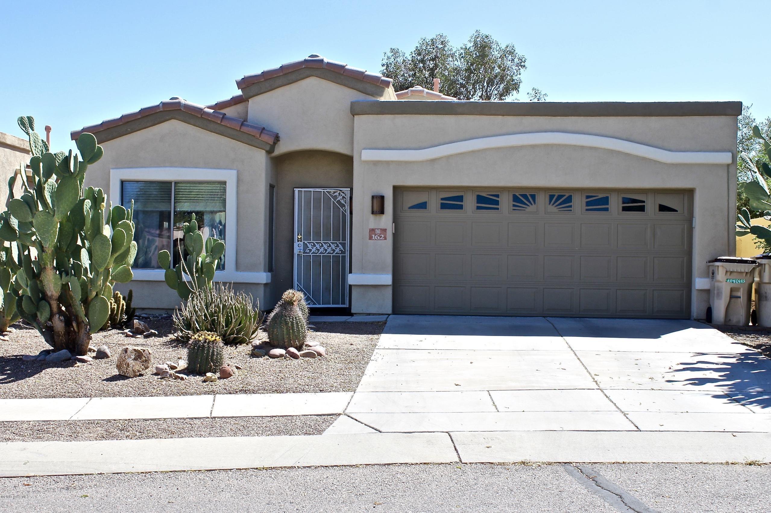 A Wonderful Single Story, 4 bdrm home with beautiful finishing touches through out! The popular Diamante floor plan provides an open layout and NO STAIRS! At the end of a quiet Cul-de-sac. Stunning laminate wood flooring adorns the formal living room/dining area, and family room. The kitchen is nicely updated with Ceramic tile flooring, Corian Counter tops, a center island with pull out shelves, SS appliances, and an attractive backsplash! A gas log fireplace enhances the cozy family room. The master suite features a separate shower and garden tub, walk in closet, & dual vanity sinks. A lovely jack and jill hall bathroom sits between the bedrooms with an optional Den that has french doors. Enjoy the Arizona evenings in the screened in patio with no houses behind for privacy! Must see!