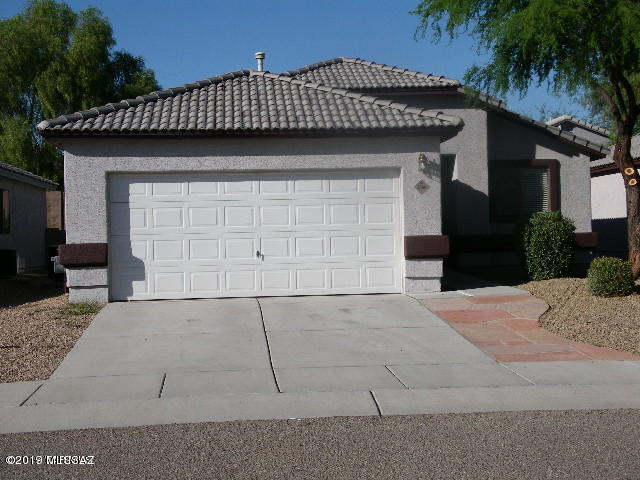Rent this Nice 3 Bedroom North West New World Home $1450-month.Steps to Foothills Mall, Bus Line, Walmart, Restaurants, Theater, Park, Dog Park, Amphi Schools,YMCA-Pool! All NEW FLOORING-TILE in all living areas and CARPET in Bedrooms. UPGRADED appliances including Washer and Dryer,NEW interior paint, Maple cabinets, Master with 2 closets-one walk in, Ceiling Fans in all bedrooms and Living area, Huge open Great Room for Large furniture. Insulated Garage door. New sinks, faucets, hardware, new dining rm light. Pretty landscaped yard with Grapefruit and Orange trees and covered patio. Garbage and Assn Fee in rent amt. Spacious Open Floor plan. Looks Brand New! Call Owner/Agent to show. Neat-Clean -and Ready!