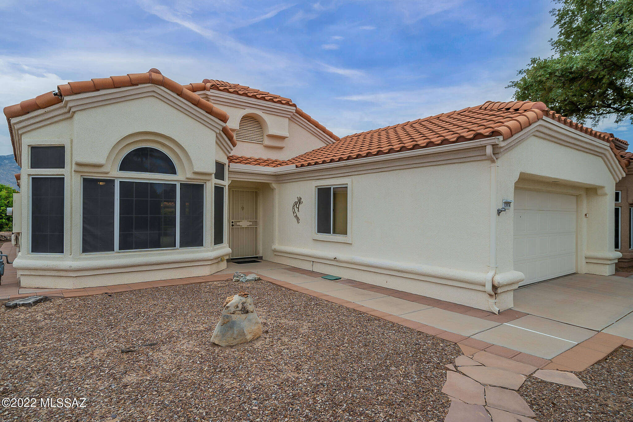 You'll feel right at home upon entering this beautiful Sonoran Model home in coveted Sun City Oro Valley. The stunning views of the Catalina Mountains, from almost every room, will take your breath away. Enjoy the chef's kitchen with island, tile backsplash, double-doored pantry closet and newer stainless-steel appliances. Large, view windows and sliding door to the back patio bring abundant natural light into the home. This home boasts a highly desirable split-bedroom floor plan for more privacy. The owner's suite has a walk-in closet plus an updated en-suite bath with new vanity and a beautiful, tiled walk-in shower. Enjoy your private, covered & extended mountain view patio right off of the kitchen and owner's suite. The layout of this home makes entertaining easy! Welcome home!