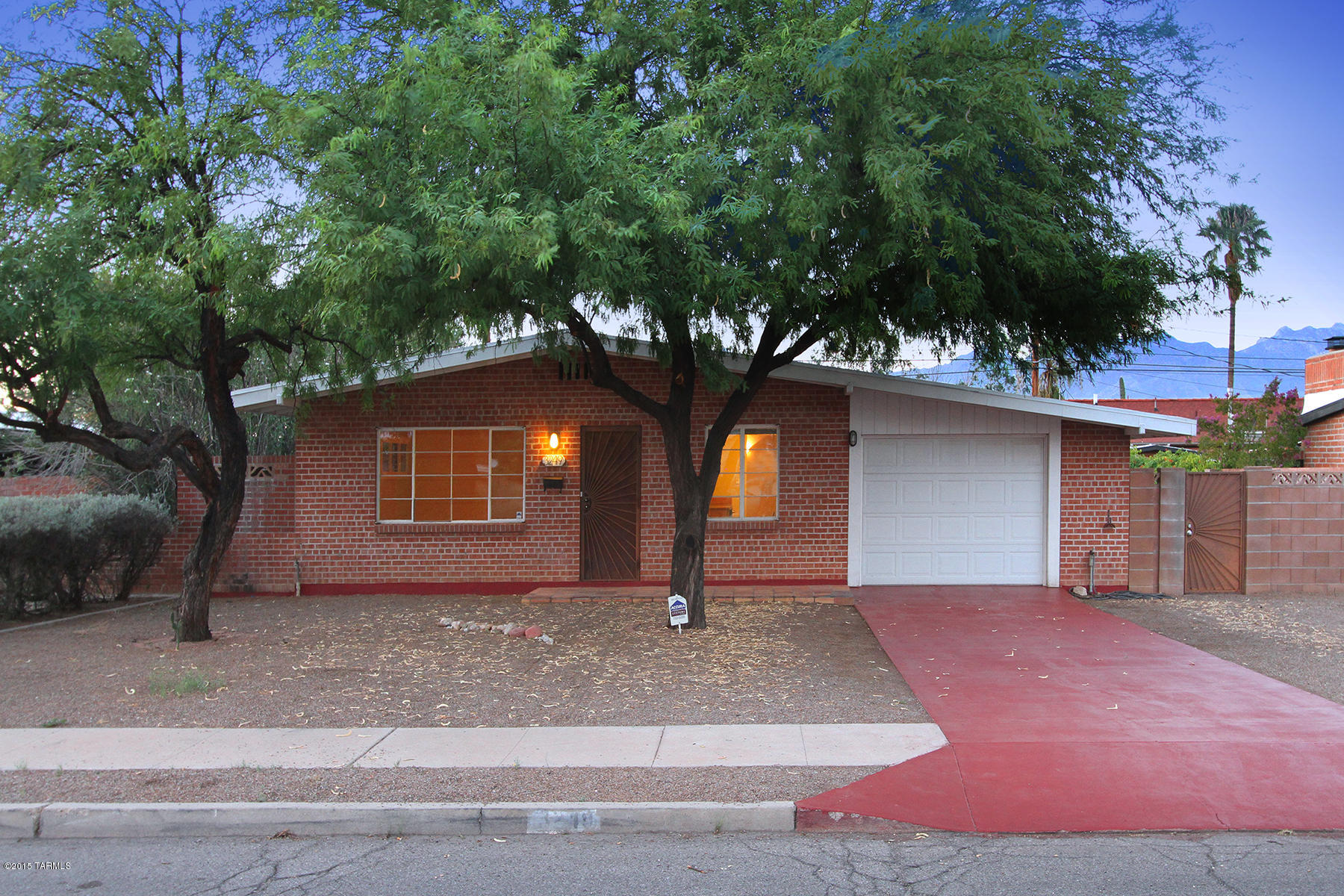 Remodeled, 3 br/2 bath with large, walled backyard (flagstone patio) in high demand Encanto Park (Sam Hughes Elementary). Great location--1 block to U of A bike path; blocks to Whole Foods, other stores/restaurants--1 mile to U of A. Remodeled kitchen with Birch/Alder cabinets, stainless appliances. Lots of Mexican tile! Great ambiance! High quality entry doors! Freshly painted interior/new Br carpets. Large, 10,000+ sqft allows potential guest house & home expansion.