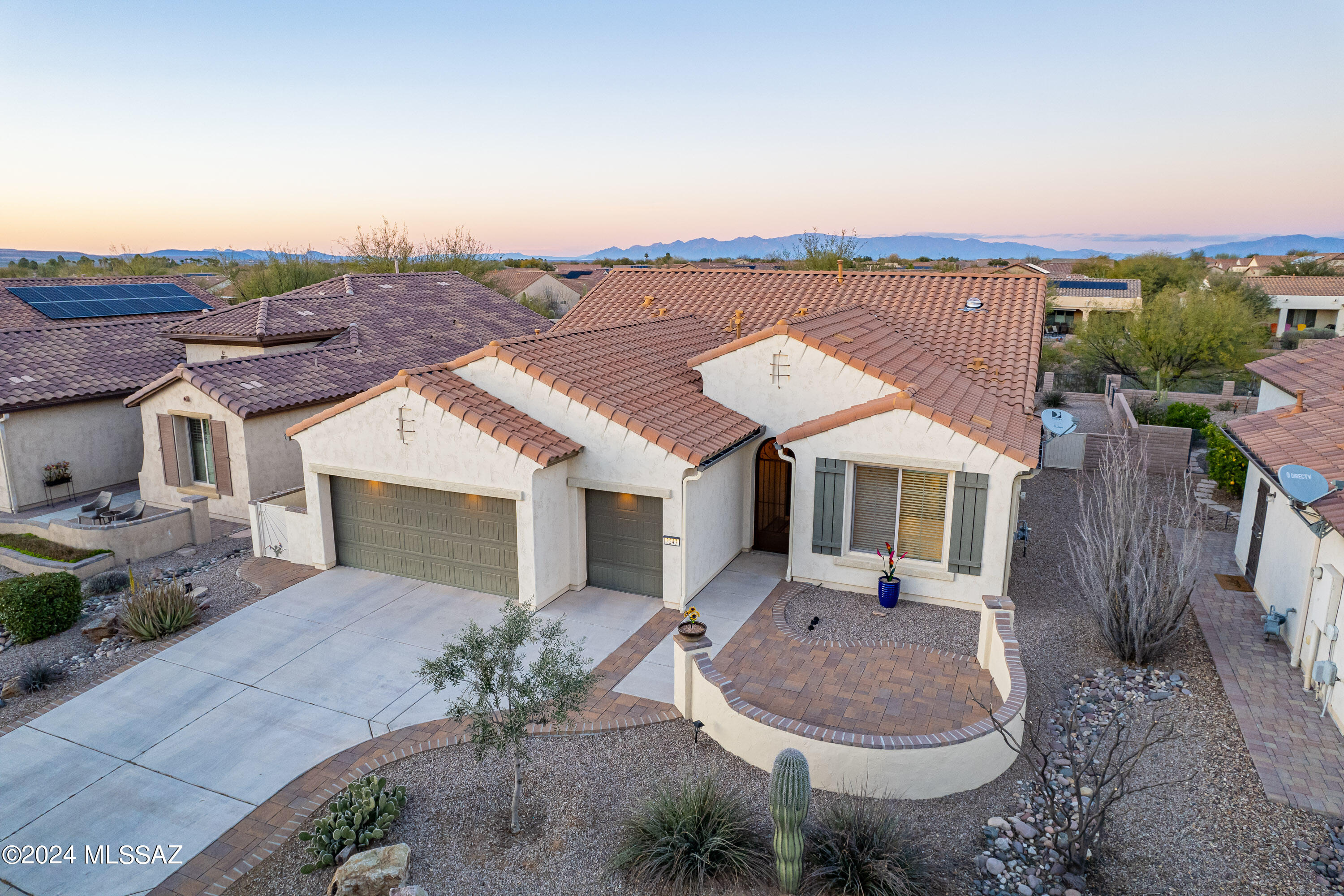 THIS HOUSE HAS THE FEATURES YOU WANT AND IS FULLY FURNISHED!  Turn the key to find a modern floorplan that includes two bedroom suites and a powder room, neutral tile and fans throughout, contemporary fixtures, a 2.5 car extended garage with epoxy flooring and storage, and a fully walled/gated yard that backs up to a private wash. This Agave model also offers a front courtyard with peek-a-boo mountain views and a neighborhood of friendly people!  Inside, you'll find neutral window coverings, paint and tile. The kitchen boasts pull-out shelves, granite countertops with a stylish backsplash, s/s appliances, and a gas stove. You'll appreciate a water softener and a whole house water filtration system.  Simply bring your clothes and golf clubs to start enjoying the Quail Creek lifestyle.