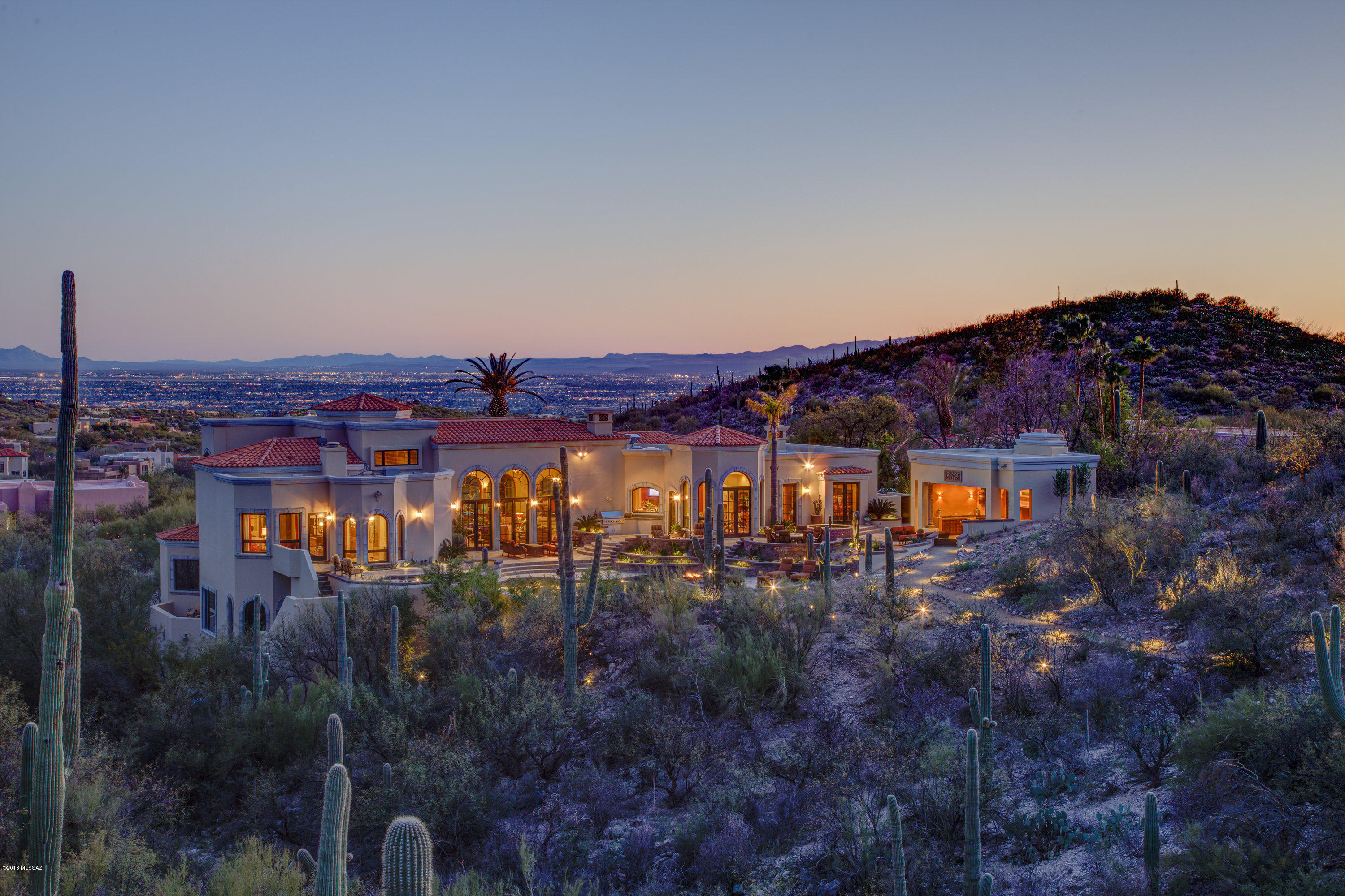 Just Reduced by $1,500,000! This grand Foothills estate, located in prestigious Finisterra, recently underwent a 2 year, multi-million dollar renovation by the current owners who sourced materials from around the globe to create a true showplace. As you enter, your eyes are immediately drawn to the Saguaro studded Natl Forest towering over the breathtaking backyard w/pool, spa & entertaining pavilion. The elaborate kitchen features an enormous Calcutta marble island, Wolf appliances, custom walnut cabinets, antique French parquet floors & an 18th century French fireplace. This spacious home features 3 guest suites worthy of any 5 star resort & a lavish master suite w/city & mtn views, a spa like bathroom, fireplace & impressive closet. This home is available furnished w/some exclusions.