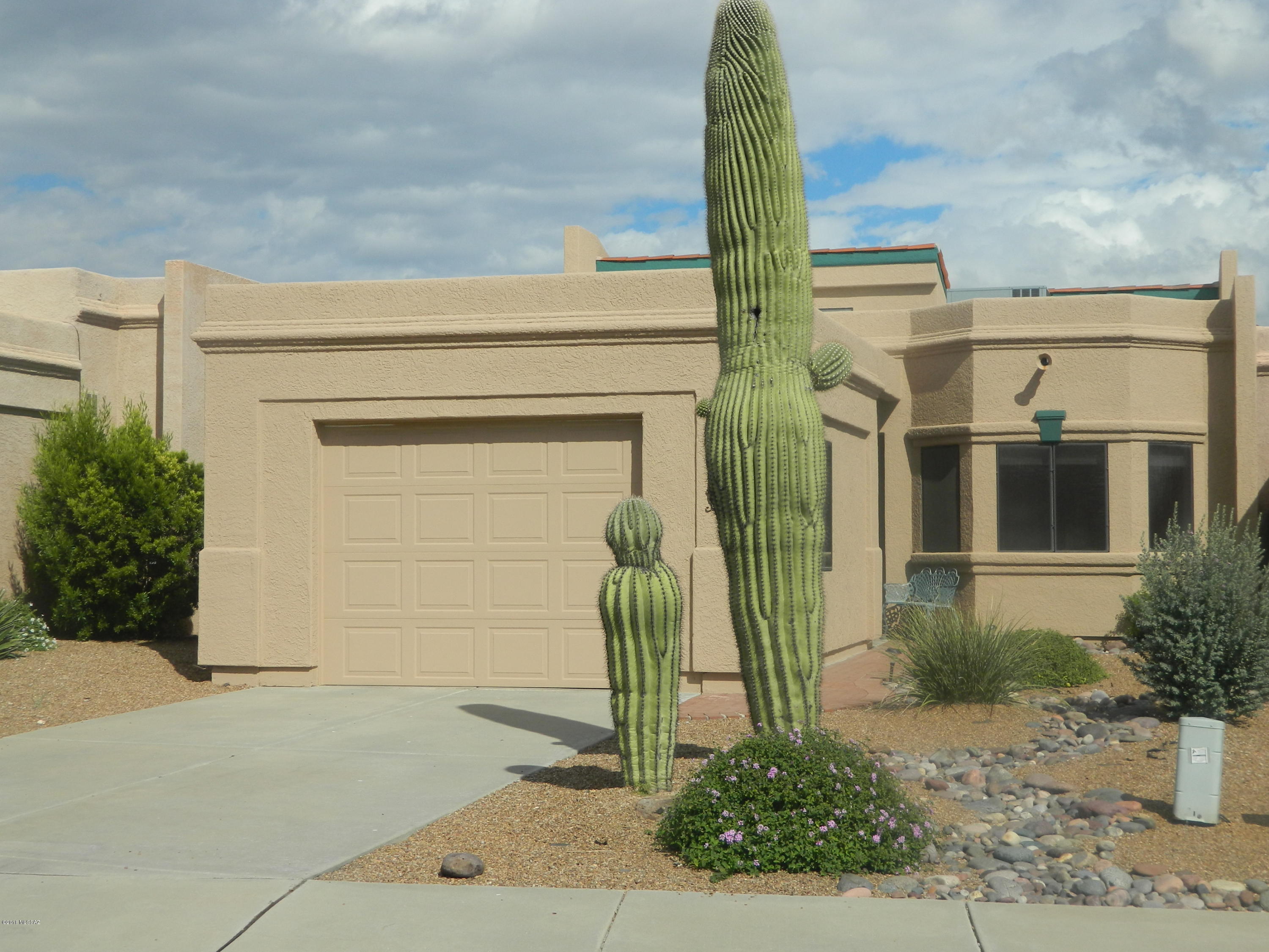 Lovely End Unit Townhome With Garage. Close To Recreation Center. Mountain Views Out Beautiful Backyard. Common Ground Area Behind. Vaulted Ceiling With Open Floor Plan. . Bay Window Master BR. Seller over late 2017/early 2018 upgraded carport to garage, replaced  heating/cooling system, built patio wall, repainted exterior, recoated roof, replaced several windows. Partially furnished. Back yard Pots, Bird Bath, Bird Hooks do not Convey.