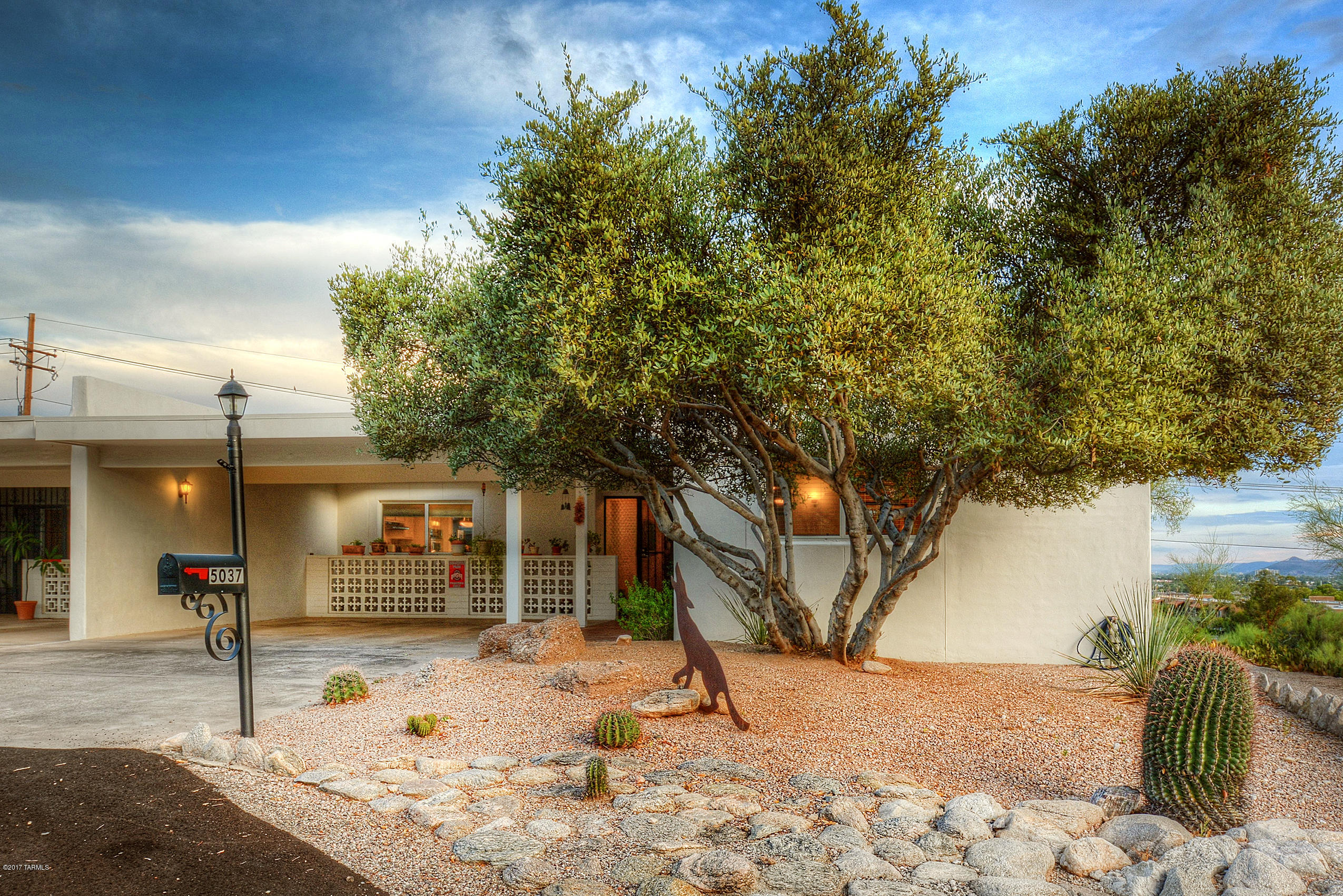 The Dramatic City Light and Sunset Views will simply amaze you! Don’t wait to see this wonderful end-unit on an oversized lot with views all the way to Downtown Tucson and beyond! Living room has a charming beehive FP, and the spacious kitchen offers Talavera tile accents and tons of cabinet & counter space. Bedrooms have large arched windows and the master offers a generous walk-in closet and ensuite bath with walk-in shower. 4 skylights make this unit light and bright. Lg covered patio provides a private place to relax and enjoy those views! New dual pane windows in kitchen, master & 1 bdrm. While classified as a “55+ adult community” up to 20% ownership allowed for persons under 55 in this tranquil commty. Great location just minutes from La Encantada, Tucson Mall, U of A, downtow
