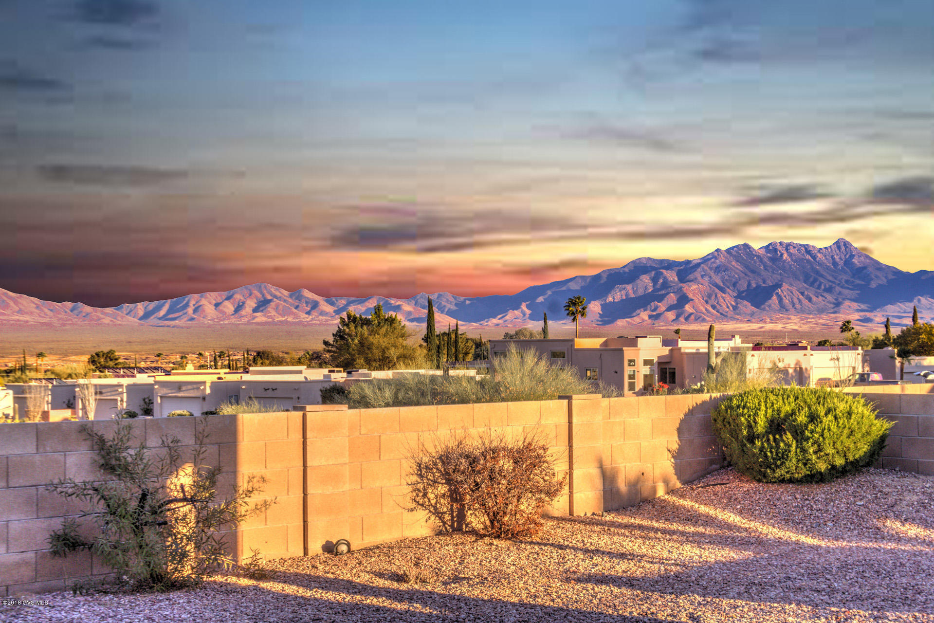 PANORAMIC, UNOBSTRUCTED SANTA RITA MOUNTAIN VIEWS!! This Outstanding, Southwestern Style Home has Absolutely Spectacular Views PLUS a whole host of other wonderful features: Beehive Gas Fireplace, Great Room/Split Floor Plan (privacy for guests!), Kitchen Island, Skylights/Lots of Natural Light, on a Private Cul-De-Sac  the list goes on and on. There's also a tile roof, and the home is relatively new (2005 construction), so it's in good condition, and it's on a Large Lot: plenty of room to add on, install a pool, etc. The Extended Two Car Garage is spacious/can easily accommodate a large truck/leave room for storage; and it's conveniently located at the North End of Green Valley, so it's close to shopping/an easy drive to Tucson. Priced to sell, this terrific property won't last lon