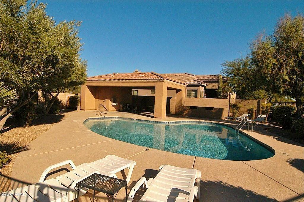 This beautiful home features one of the largest sized backyards in the neighborhood with mountain views! You'll love having your kitchen open to the conversation and activity in the adjacent living area, along with the stainless steel appliances including gas range, dishwasher, built in microwave, refrigerator plus walk-in pantry. The 20 foot vaulted ceiling in the living area allows for a spacious feel and an abundance of decorating opportunities. Three bedrooms upstairs, including the master features a private balcony with views and the large bathroom with walk-in closet and dual vanity sinks. Other bedrooms upstairs have shared Jack and Jill bath and one bedroom downstairs, perfect for an office or guest bedroom. 
Oversized laundry room includes washer and dryer plus handy sink.