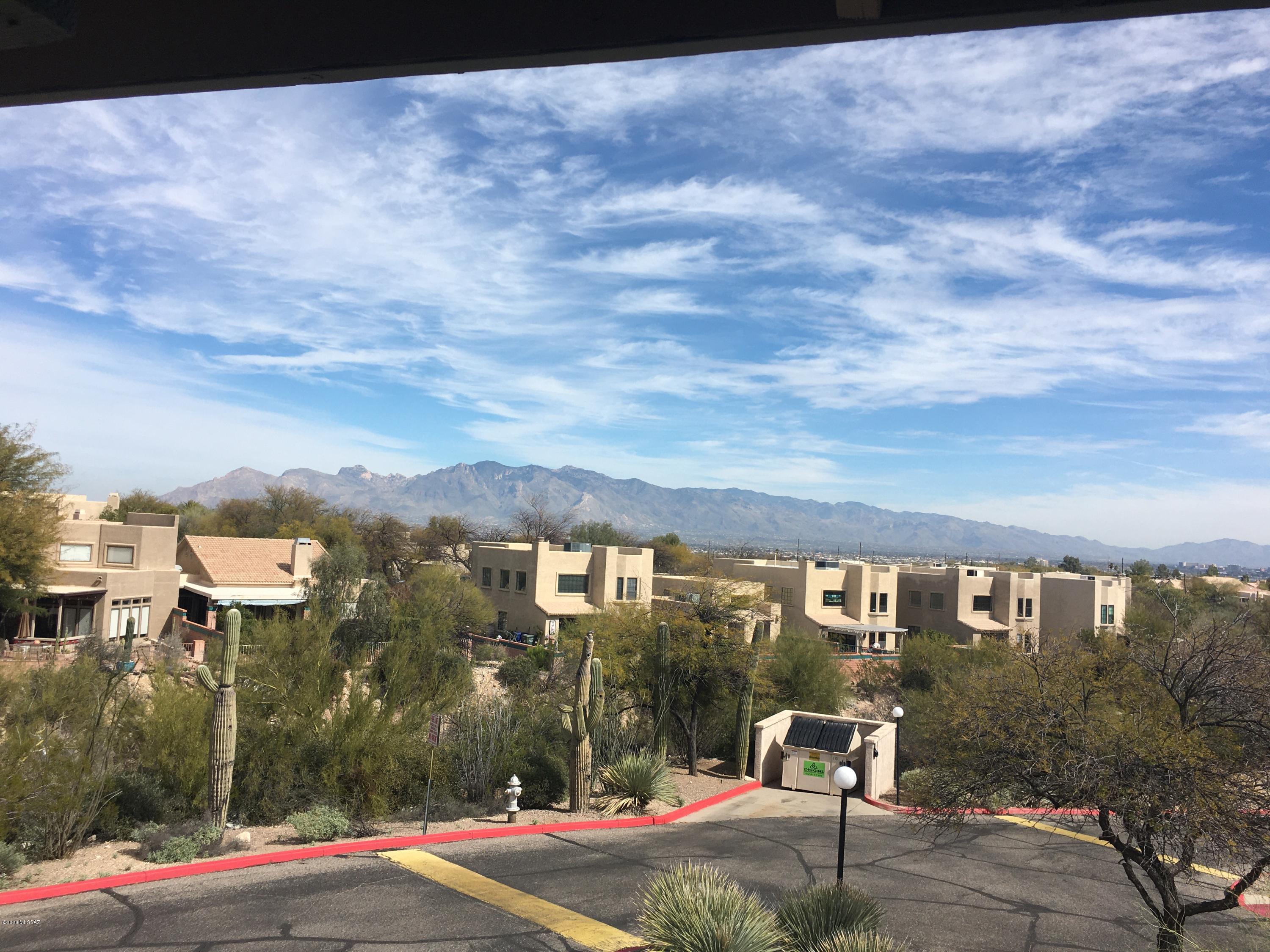 STUNNING end unit at Moonrise @ Starr Pass Condominiums near the JW Marriot. Catalina VIEWS from every room & balcony ! Freshly painted, 3 bedroom, 2 bath.  New black & SS appliances, electric range, granite counters, maple cabinets. Wood burning fireplace. Master offers large shower in bath.  2 additional bedrooms, one w/patio access.  Hall bath has tub/shower combo.  Both baths feature executive height vanities. NEW washer & dryer, lighting,  ceiling fans & HVAC. Carport. HOA includes, all common areas, paint, roof, trash, water, 2 Pools, spas and gym. JW water collection ''pools (Mon-Thurs), golf membership, 20% discount, 5 restaurants & Starbucks at the resort. Conveniently located near downtown. Community will be gated in the near  Come live the easy life ! Call for private showing !
