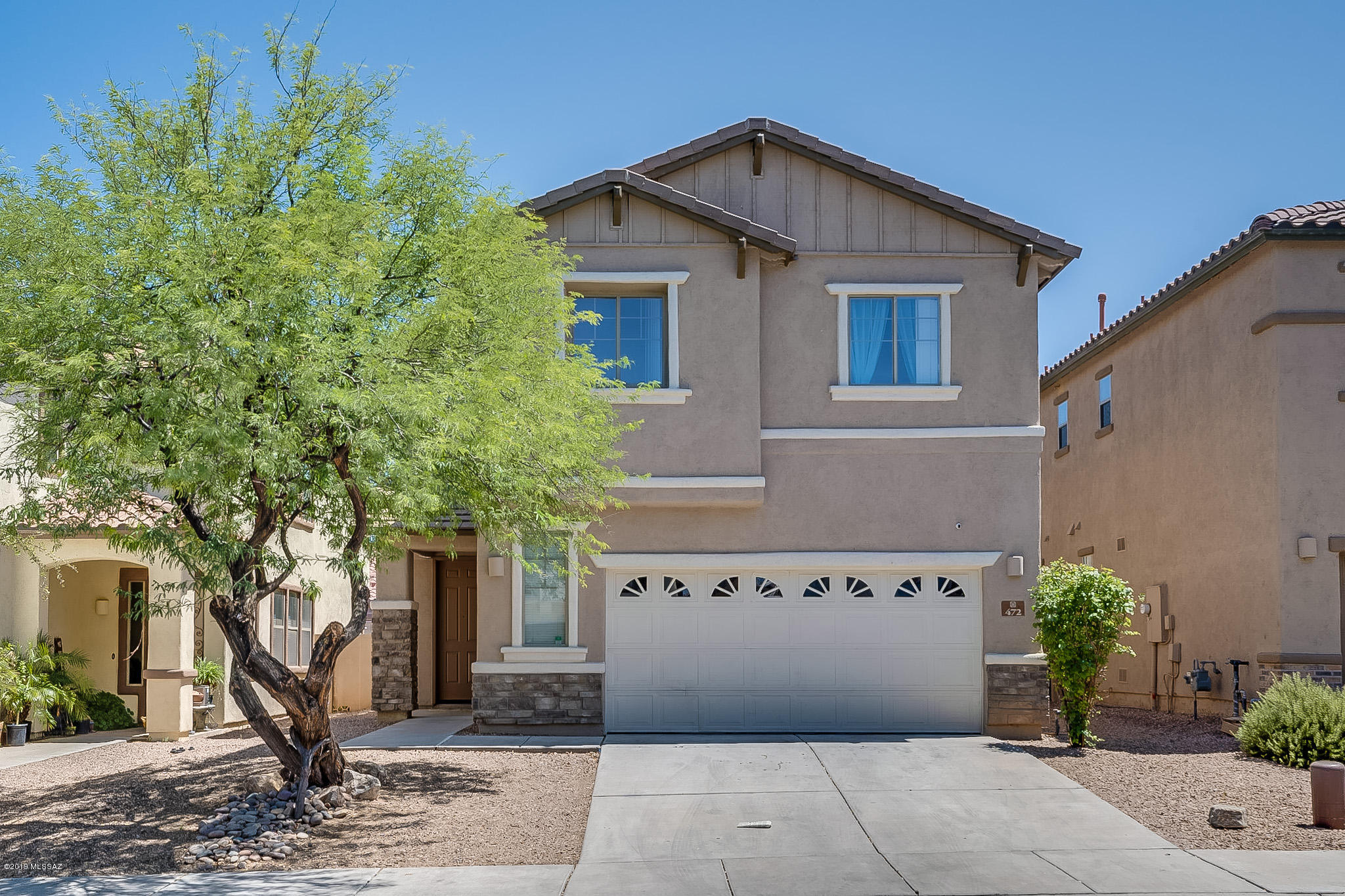 This lovely home is centrally located in a gated area within the amenity rich community of Rancho Sahuarita.  The 1878 Sq.' two story home features a neutral color scheme with tile throughout the first floor.  The kitchen opens to a dining area with granite counters and stainless-steel appliances.   The living room has a gas fireplace and is open to the upstairs giving it a dramatic feel.  The master bedroom is spacious with a ceiling fan and private balcony accessed through French doors.  The master bathroom has a garden tub, separate shower, dual sinks and large walk-in closet.  You will find a full hall bathroom, laundry room and three additions bedrooms on the second level.  If you are handy with paint or like a basic home improvement projects this may be the deal for you.