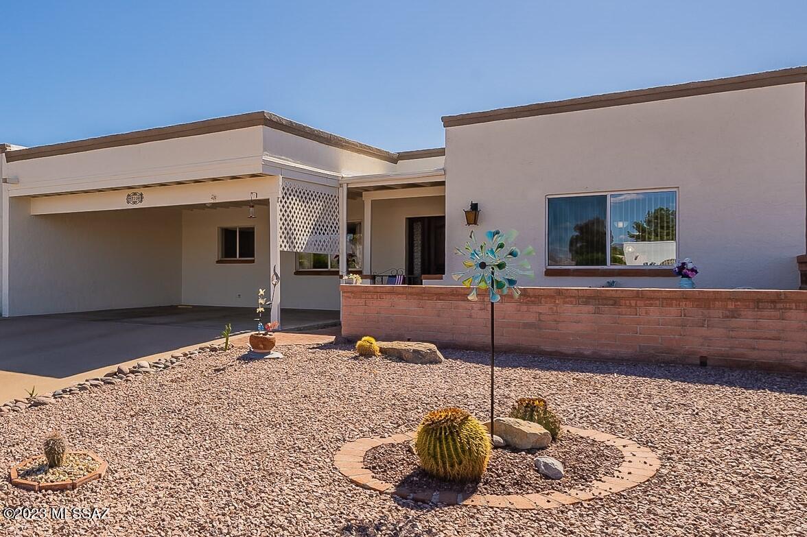 Located on the Country Club of Green Valley golf course, plus mountain view, Recently, delightfully updated and low HOA dues! What more can you want?   Well, there is the large front courtyard with those mountain view, plus a screened in porch that looks out to the greenery of the golf course. The home was nicely updated approximately a year ago with the kitchen updates of stainless steel appliances, Electric stove with stunning stainless-steel backsplash.  Corian countertops. Solid surface wood look flooring upgrade through most of the home.  Spacious living rm features attractive fireplace you can cozy around on a cold night. The interior offers great storage space and there is storage room out back.  Plus roof was recoated this past year. Enjoy Green Valley Recreation  for your  fun!