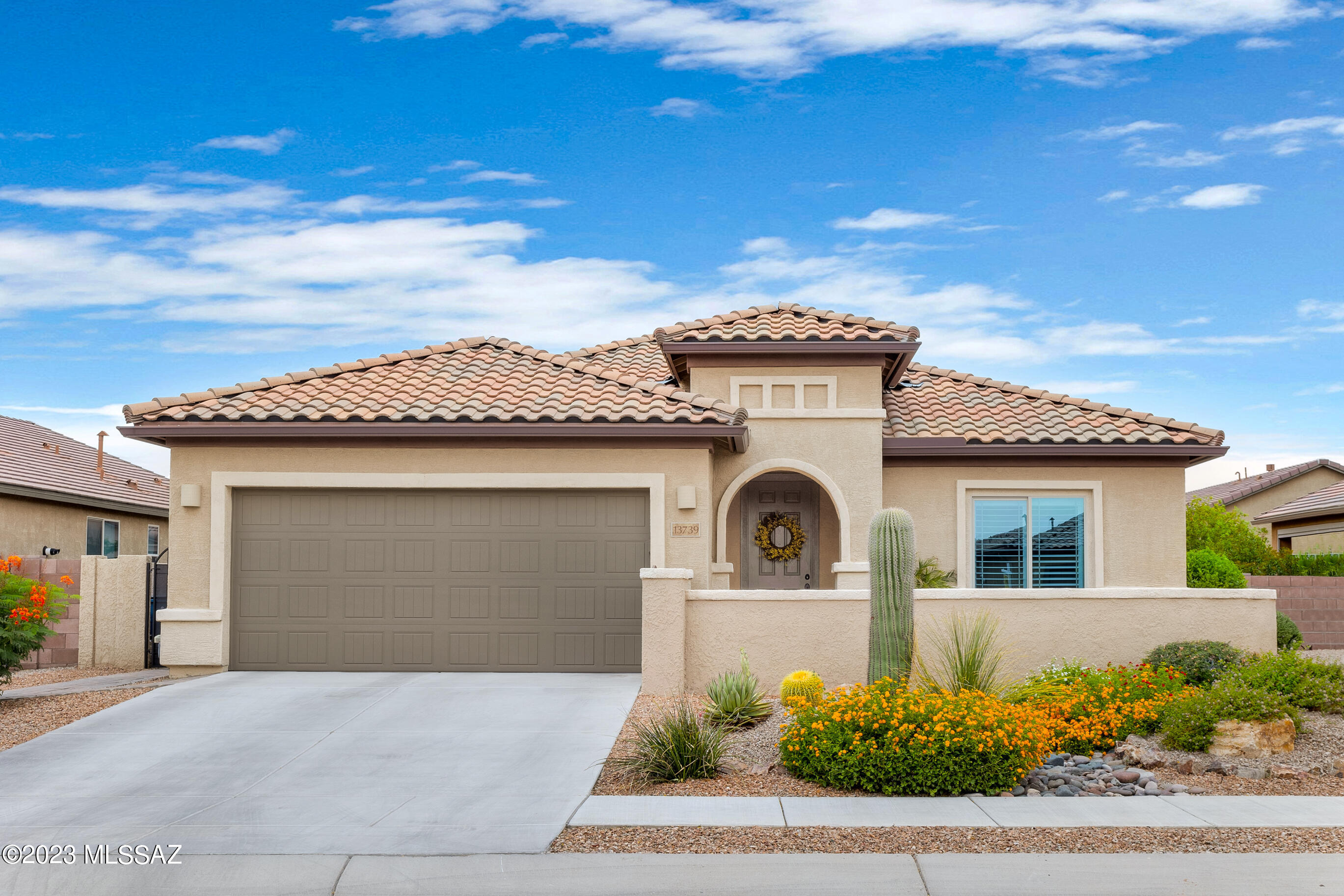 Located in the gated, age restricted, 55+ Del Webb, this Essence floor plan is one of the most popular with a spacious great room with huge rounded island off the kitchen to tie it all together. The gourmet kitchen package creates the built in oven/microwave plus gas stovetop and stove hood with custom backsplash. Plus the 2.5 car tandem garage, fully insulated, to offer extra storage or place to park your golf cart, motorcycle, toys, etc. 2 walk in closets in the master, one additionally expanded, for even more storage. Enjoy your covered patio out back on the north side or the open courtyard in front to enjoy all the AZ seasons. All this in a welcoming community full of clubs, activities and amenities like pickleball, pool, spa, fitness center, tennis, putting green, bocce ball & more!
