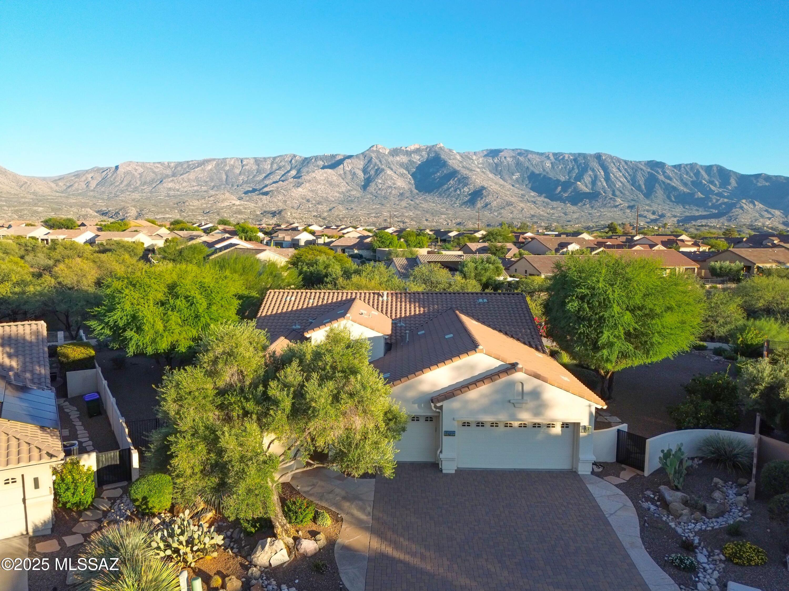 This gorgeous 2-bed, 2-bath home — plus a den — with a private 1-bed/1-bath casita in Saddlebrooke, Arizona has it all: beautiful curb appeal, low-care landscaping, and a 3-car garage. Step inside to a bright, open great room with tile floors, a neutral palette, and a cozy fireplace. The chef's kitchen boasts wood cabinetry, granite counters, tile backsplash, built-in appliances, a pantry, and a two-tier island with breakfast bar. The primary suite offers outdoor access, dual sinks, and a walk-in closet. The den adds flexible space for work or reading. Sitting on one of the largest cul-sac lots, this home offers privacy, mountain views, and resort-style living with golf, pools, fitness, pickleball, and more!
Price range $599,900-$629,900 Lastly, the expansive backyard includes a covered patio, flagstone seating areas, a built-in BBQ, fire pit, and fantastic mountain views! What are you waiting for? Don't miss out!