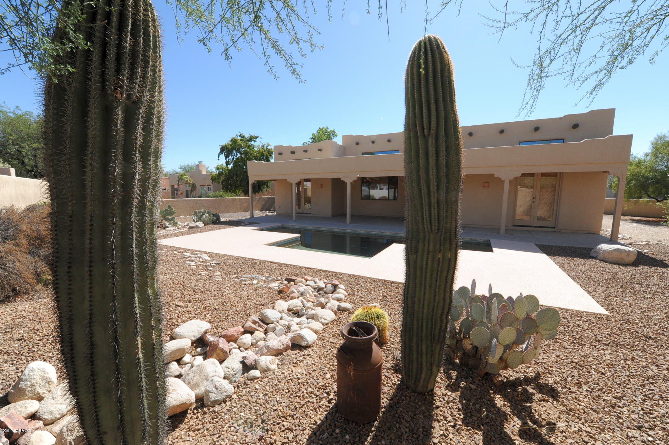 Great home on quite cul de sac north of Orange Grove between 1st Avenue and Oracle with private pool and backs to common area to the west.  Three car garage.  Saltillo tile and carpet.   Kitchen has eat in area and family room to west of kitchen.   Half bath near kitchen and garage.  Formal dining area and livingroom with gas fireplace.  3 bedroom /2 1/2 bath.   All bedrooms and patio have ceiling fans.  Master bedroom has large walk in closet and  doors going out to pool & patio.   Master bath tub is a step down tub with shower and two vanities.   Laundry room has hook ups for gas and electric dryer.  No refrigerator.   Gas cooktop on island. Wall oven and wall microwave.  Newer dishwasher.Ask about P#360-M