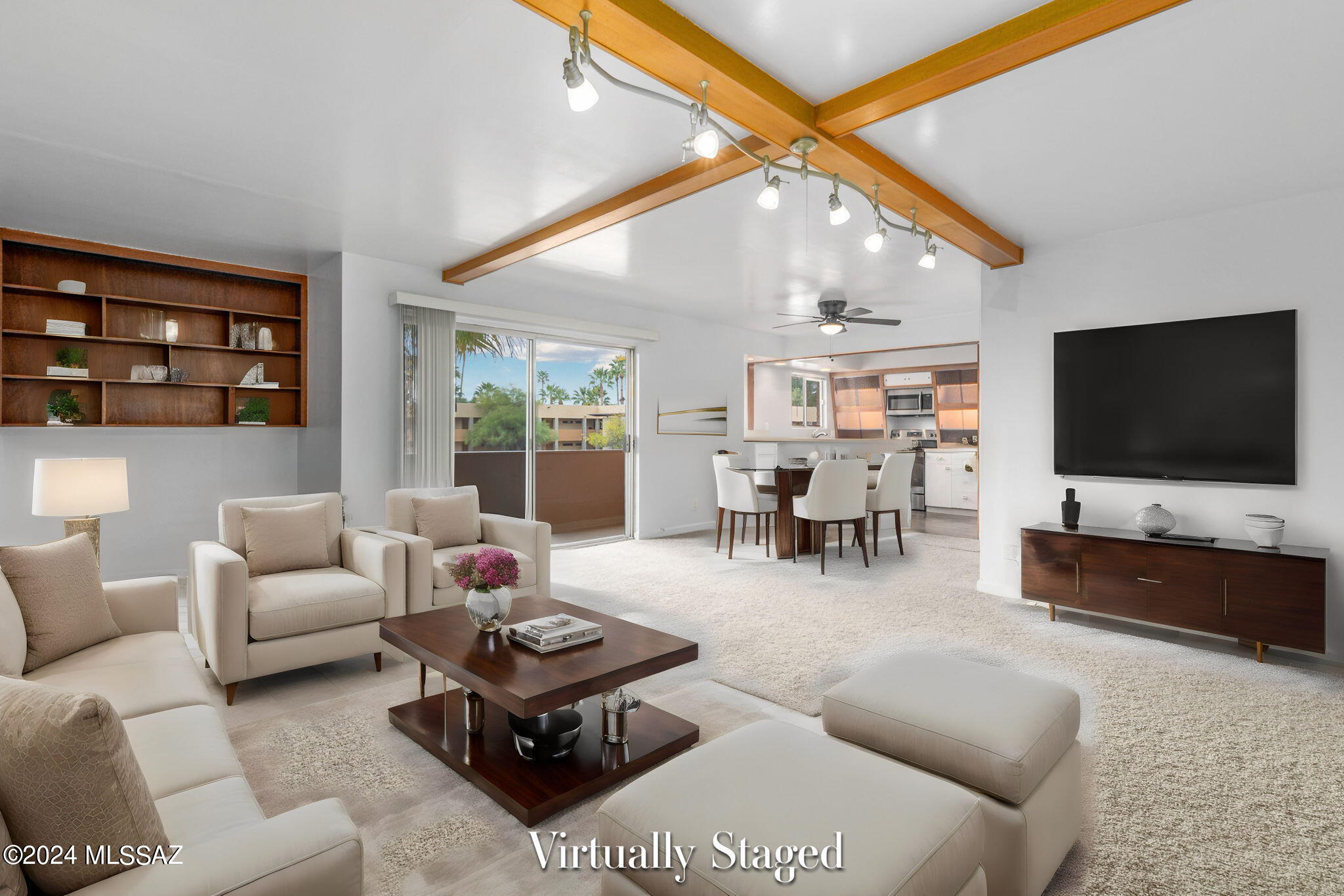 Fantastic, move in ready condo located perfectly in Central Tucson with fabulous Catalina Mountain views. Easy walking distance to shopping, restaurants, golf, Reid park zoo, walking paths, tennis courts. So much to offer in this perfect location. This second story condo has just enough of the charm from when it was originally built to give you an idea of the luxury that came along with living here in the 60's. The upgraded bathrooms and kitchen along with all new appliances, new carpet and painted throughout...It really is a must see!!! Lots of storage in the condo along with more storage in the shared GARAGE!! This condo would make a fabulous rental or vacation home.