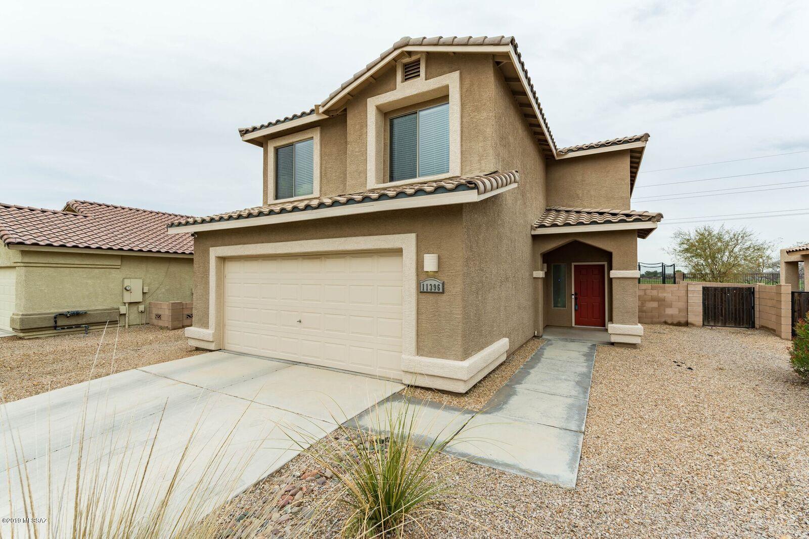 California Contemporary in Marana's popular Harvest Moon at Gladden Farms on private greenbelt lot offers 4BD/ 2.5BA/ 1,946sqft.  Dramatic 18ft vaulted ceiling, calming color palate, & timeless finishes compliment this inviting home. 1st Floor offers formal living + dining room areas upon entry, family room off kitchen w/ slider to backyard, eat-in dining area in kitchen, plus prep-island. 2nd Floor offers masterâ€™s retreat w/ private balcony overlooking greenbelt w/ views! Well executed backyard backs to greenbelt & boasts covered patio, firepit, fruit trees, extended seating area, w/ more than enough room to add a pool or express your landscaping creativity! Community features numerous parks, playgrounds, jogging paths, ramadas, sports fields, splash pad & new elementary school.