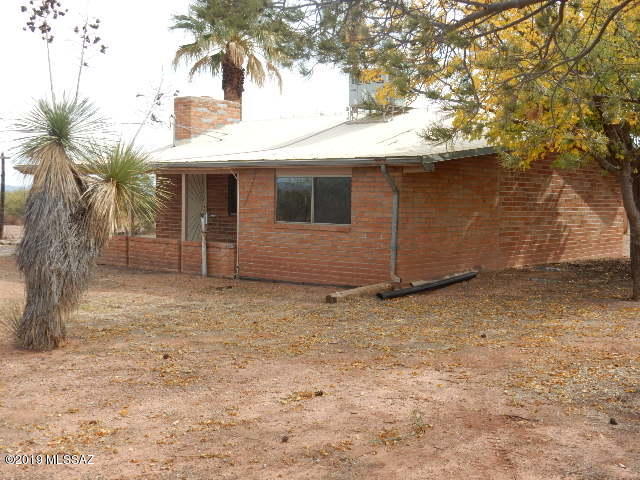 Lots of Room to roam and bring your horses. 
 Upgraded 2 bedroom 1 bath Burnt Adobe Brick Home on 16 Acres  New AC/Heat Pump. Upgraded electrical Service Panel.  New Vinyl clad Windows.  New Hot water tank.  Newer carpet and tile.   Lots of wood paneling,    Tung and Groove Ceilings thruout.
