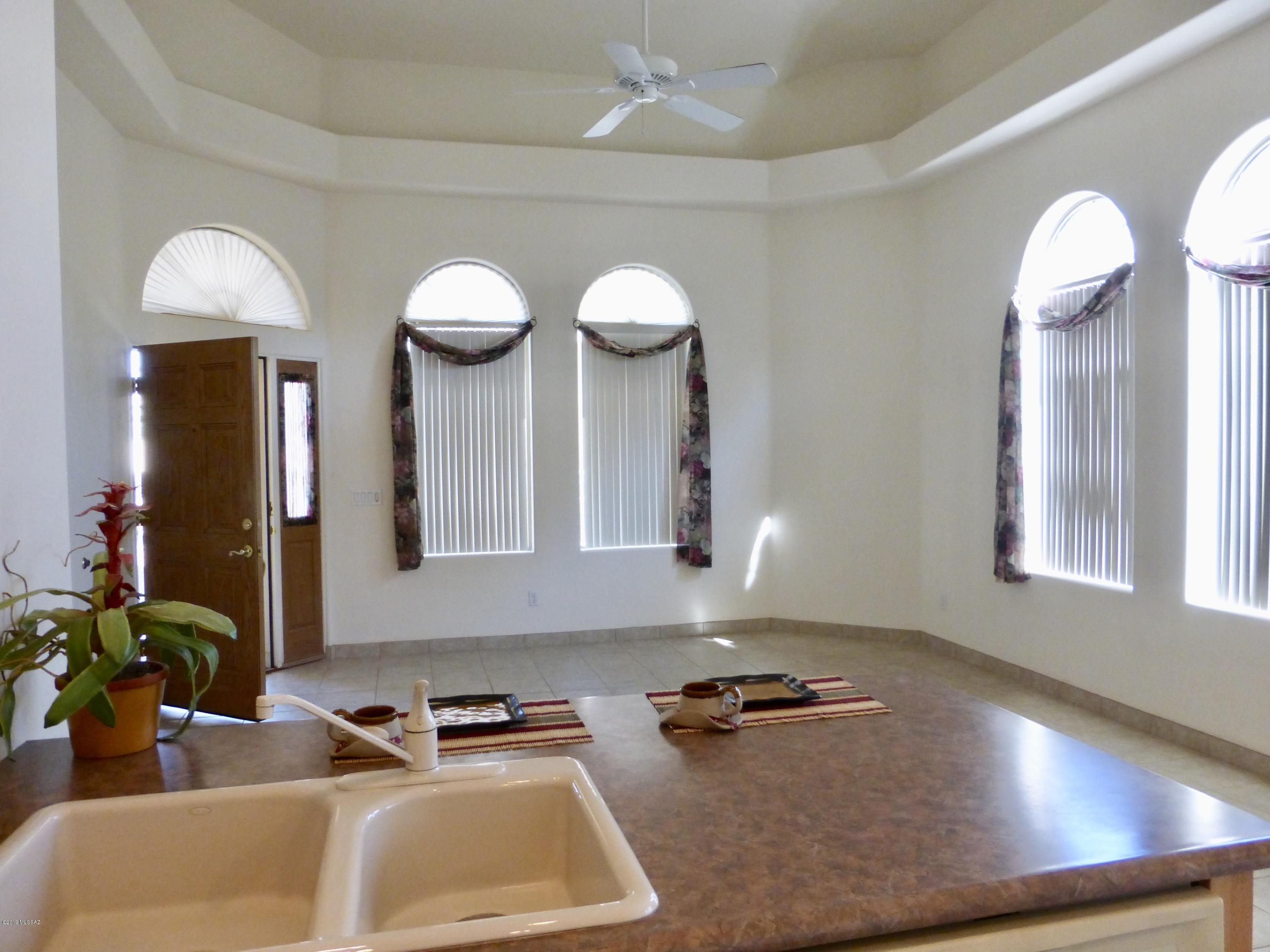 Resort Lifestyle in this NW 55+ Gated Adult Community. Immaculate 1BR/1BA Patio Home in a very private location. 1BR Great Room is larger than 2BR. Dual walk-in MBR Closets. 2X6 Steel construction, Security pre-wire, Post-tension slab. New Tile & Carpet in 2016. Neutral Colors & Large Great Room. Fans, & in great condition, with gently used Appliances. Laundry Closest for Washer & Dryer. Enjoy the Community Pool/Spa, Clubhouse, Exercise Equipment & more! Close to all amenities, near the Foothills Mall, Pima College, Library, Parks & the YMCA. The HOA includes: Water, Sewer, Garbage, Tile Roof, Exterior Paint, Common Areas, Street, Pool/Spa, & Gated Entry. Move-in. This home will sell fast! AHS thru March of 2020.