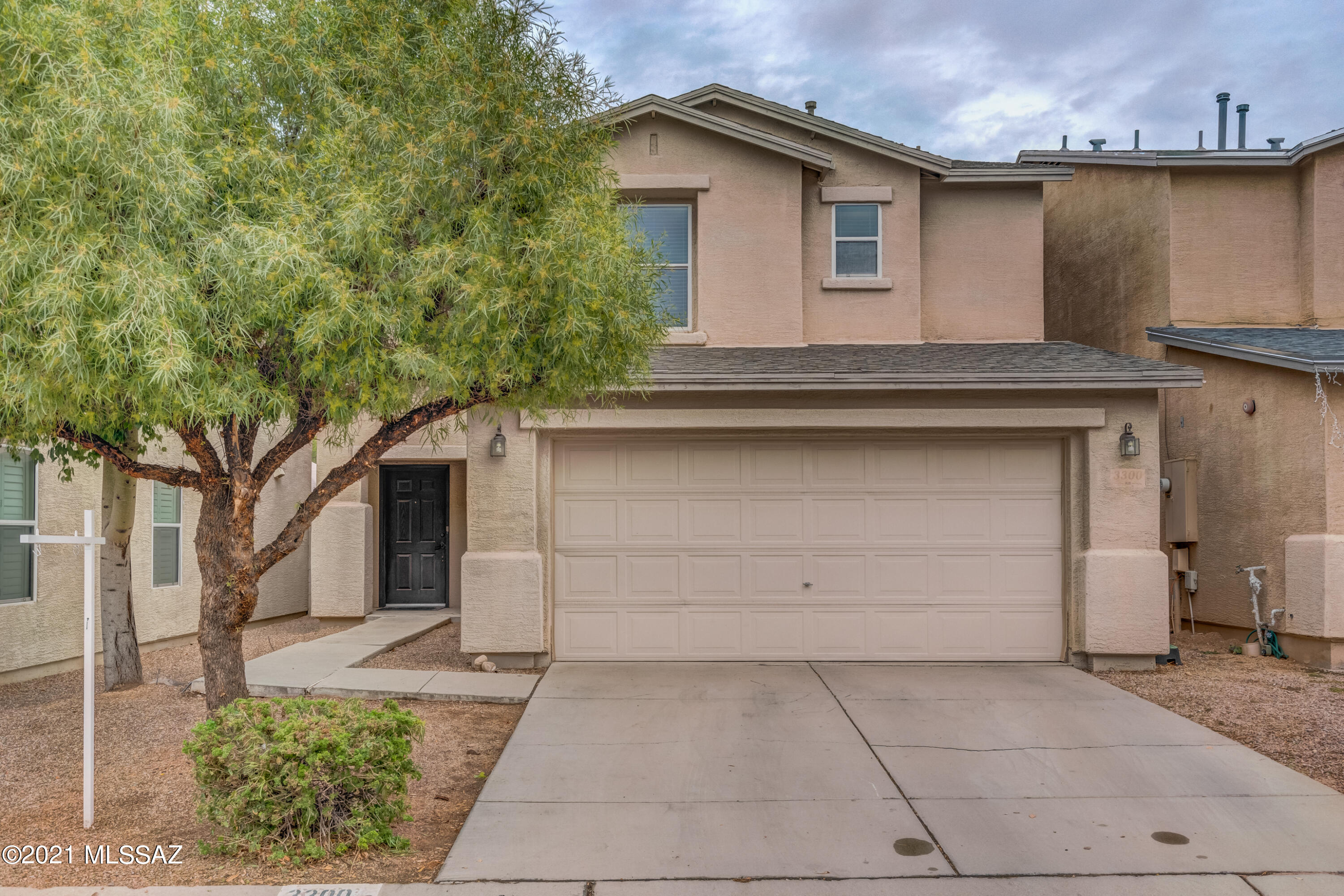 Ease of homeownership at your fingertips.  This two-story home offers brand new carpet, new interior paint, spacious kitchen with movable island, undermount microwave, stainless steel appliances, and gas range.  There is a powder room downstairs for guests, 3-spacious bedrooms with ceiling fans, newer roof (2019), newer AC unit (3.5-years old), and 2-car garage.  North/South exposure, covered patio, easy care landscaping, close to shopping, schools and the I-10.  This home has it all!  Come see today.